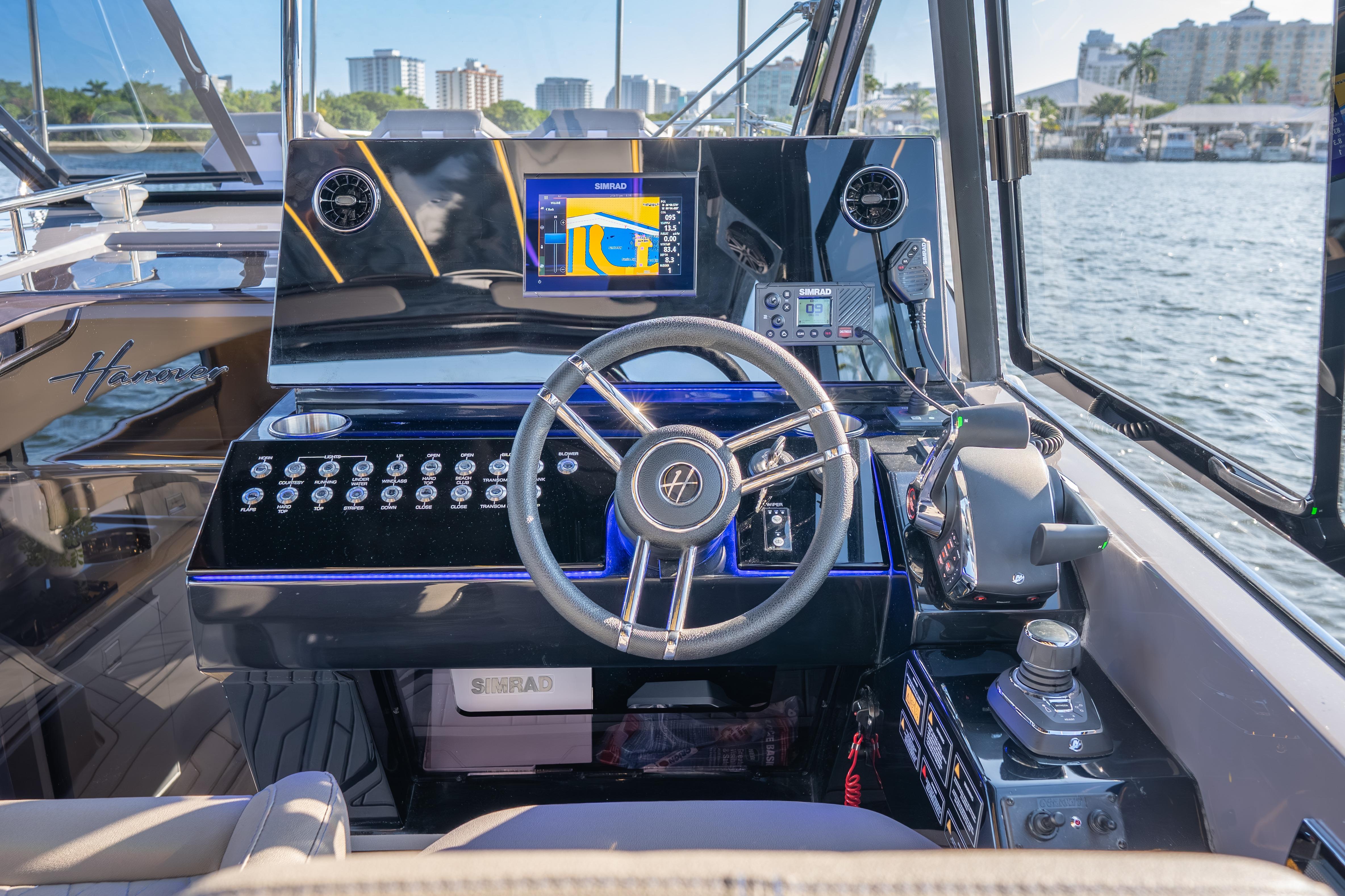Helm of 2026 Hanover 347 boat with advanced navigation system and controls.