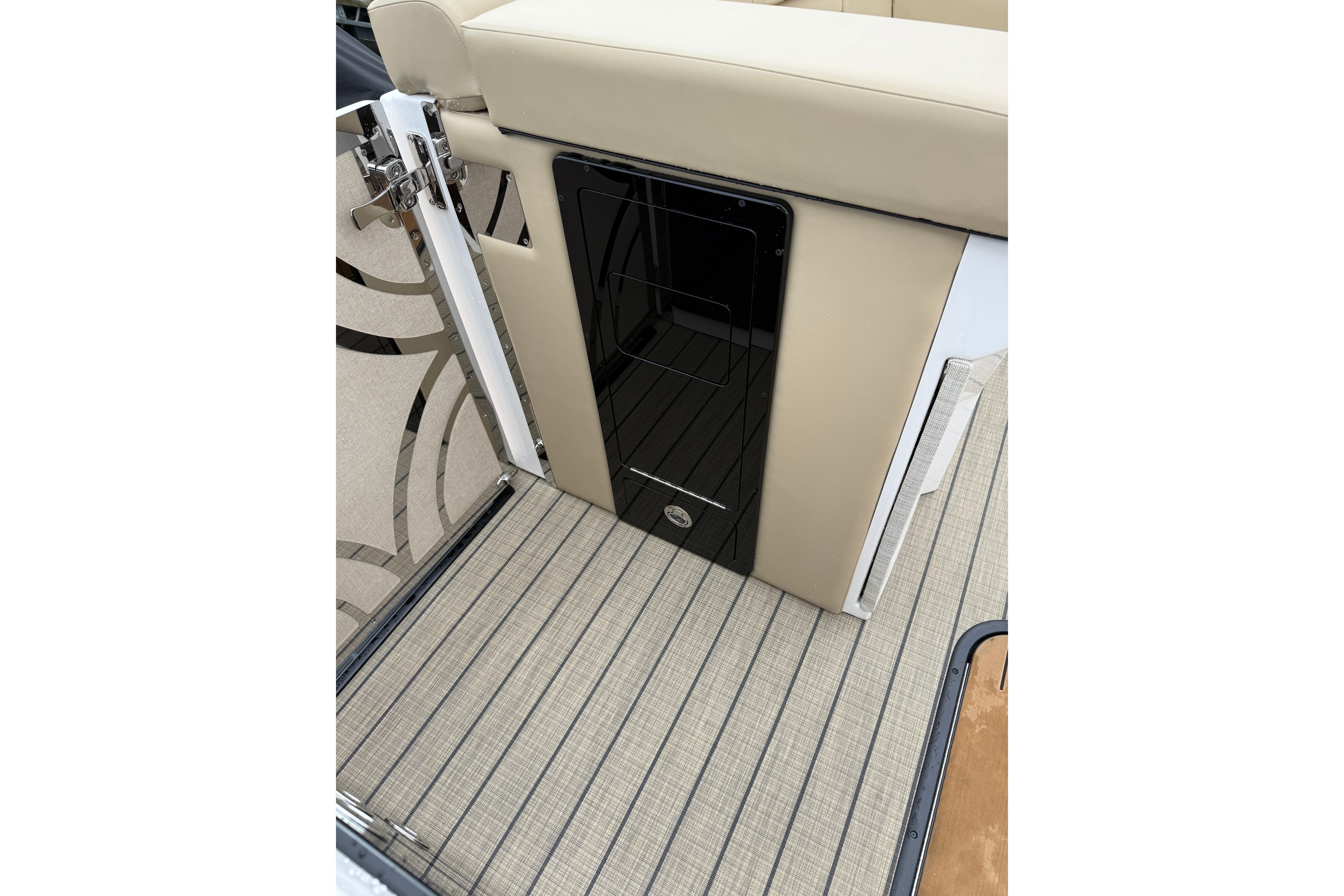 Interior of 2025 Balise Helix 26 L boat with beige seating and patterned flooring.