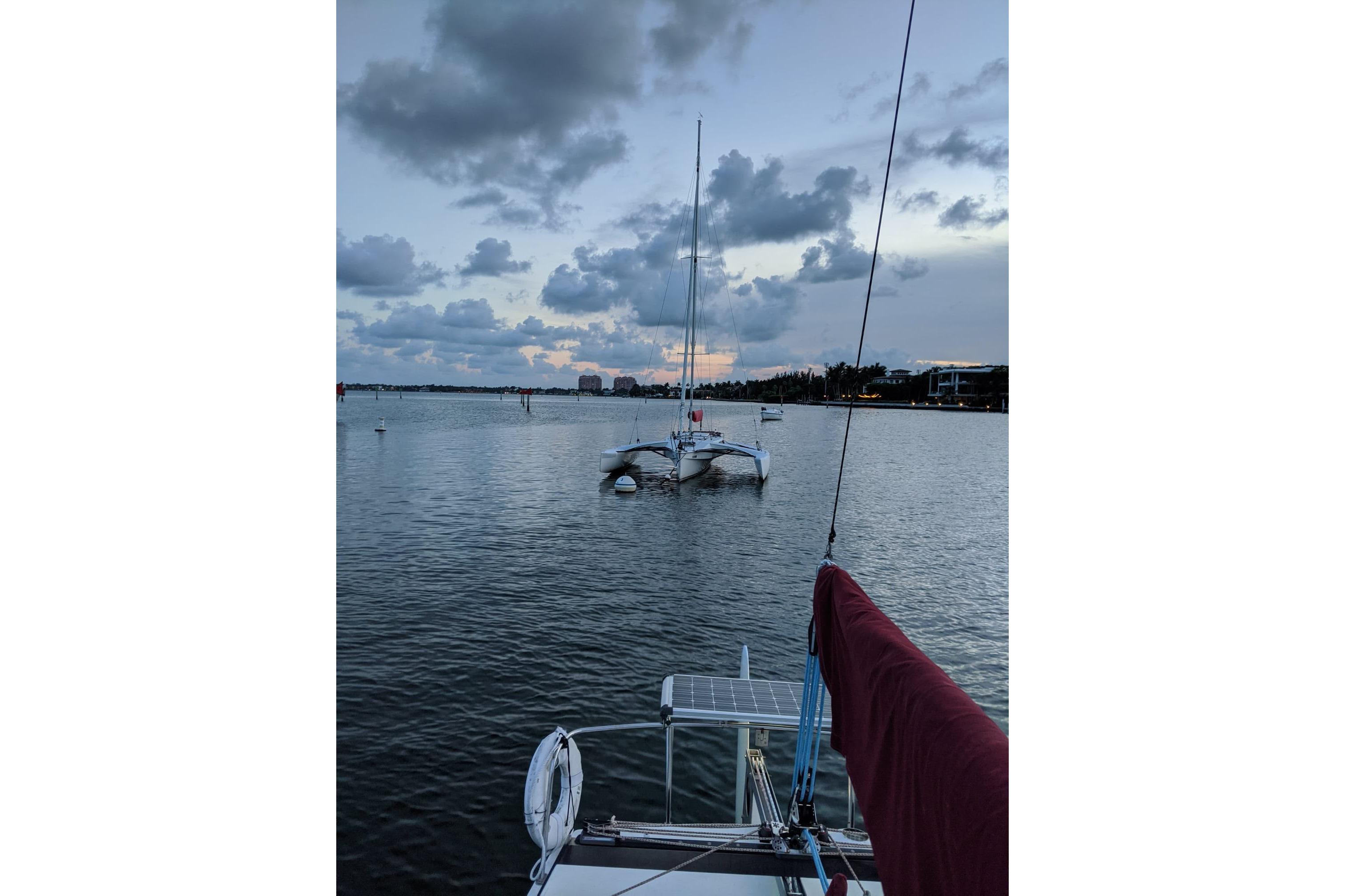 Sailboat on calm waters at dusk, Corsair F-27, 1991 model.