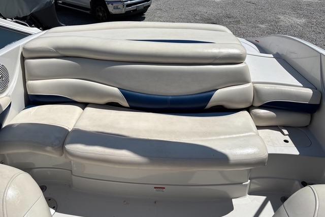 2012 Tahoe Q8 SSi boat interior with white and blue cushioned seating.