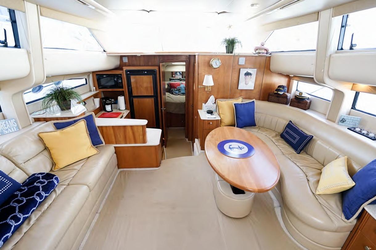 Luxurious interior of 2004 Meridian 459 Motoryacht with plush seating and elegant decor.