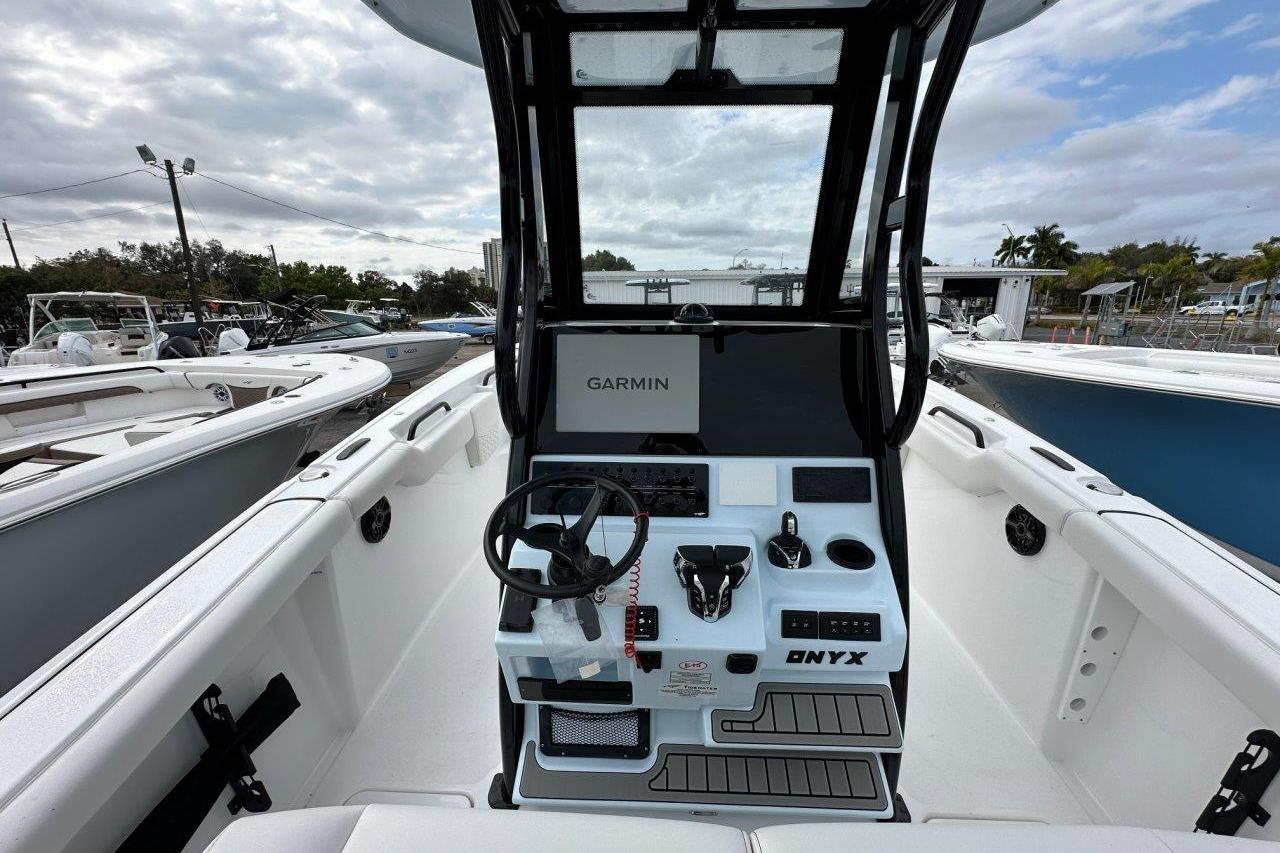 2026 Tidewater 272 LXF boat cockpit with Garmin navigation system, sleek design, and modern controls.