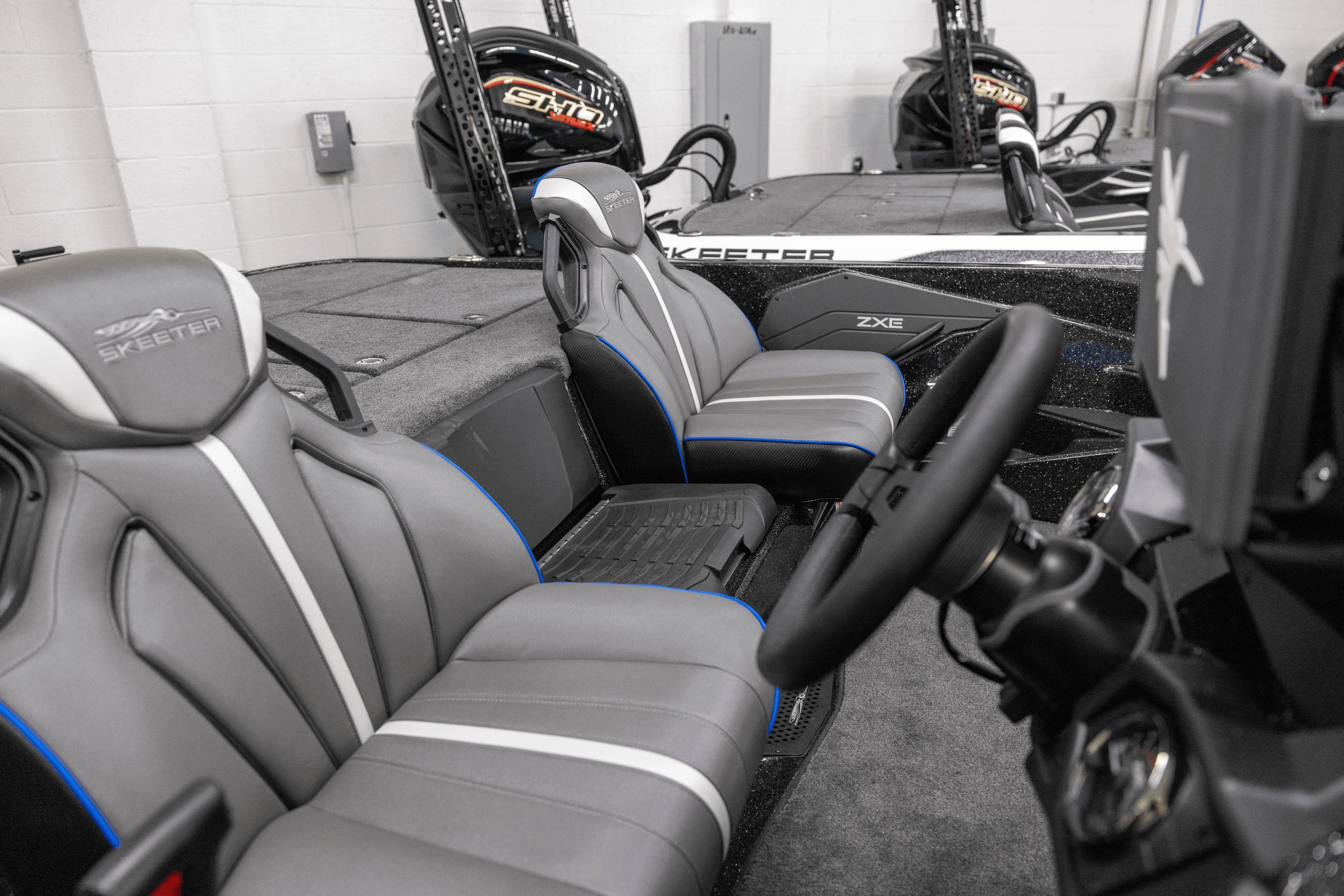 2026 Skeeter ZXE21 boat interior with sleek gray seats and modern steering console.