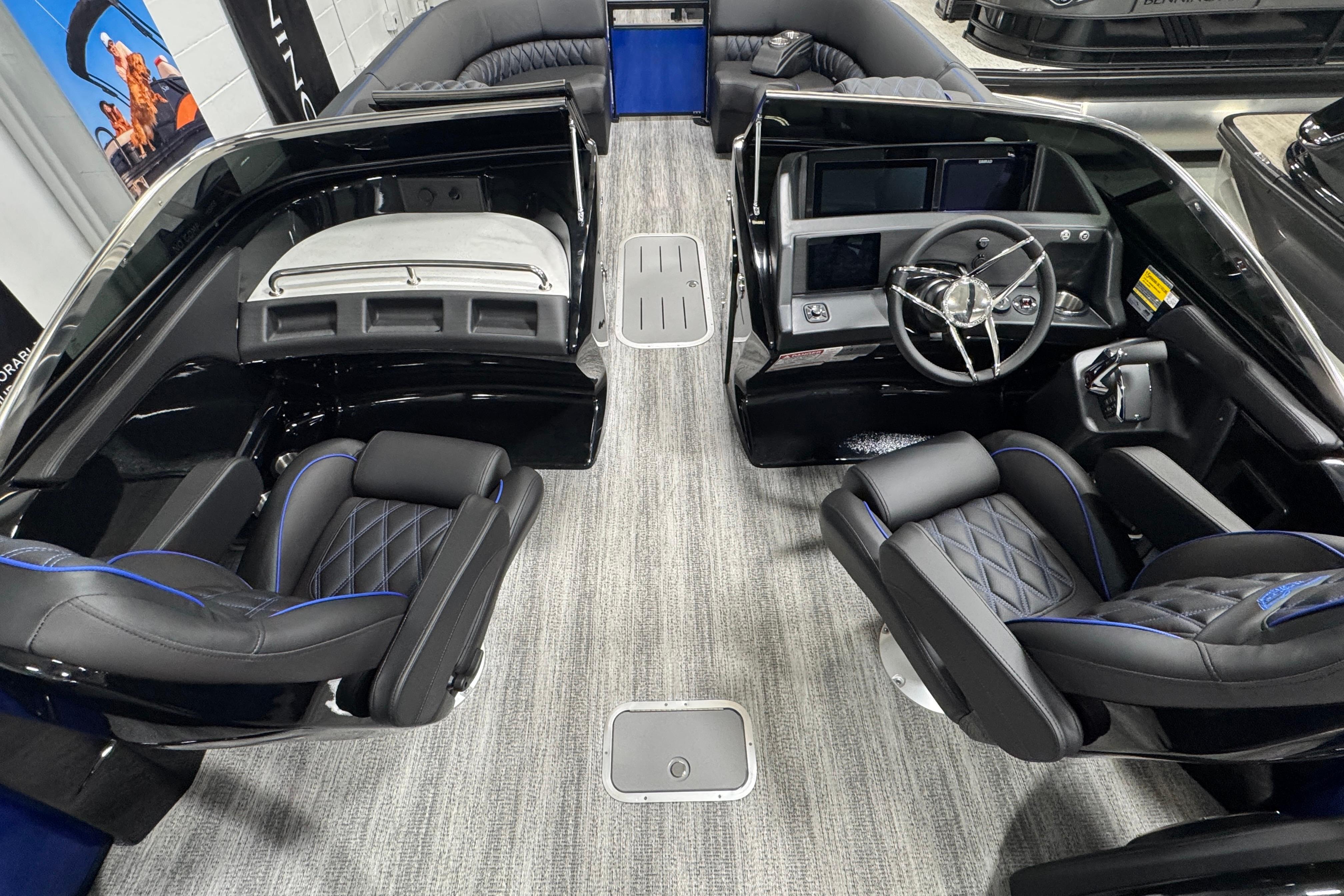 2026 Bennington 25 QSBWASE boat interior with luxurious seating and modern dashboard.