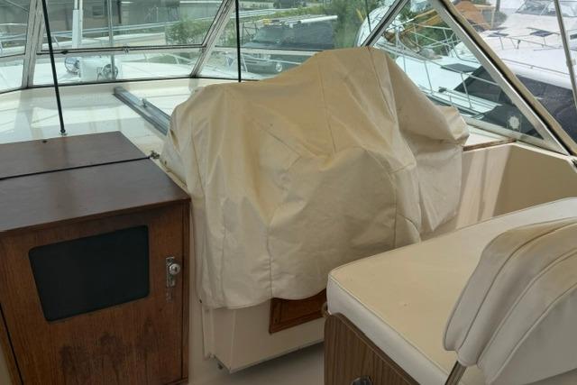 1980 Chris-Craft 381 Catalina boat interior with covered helm and seating area.