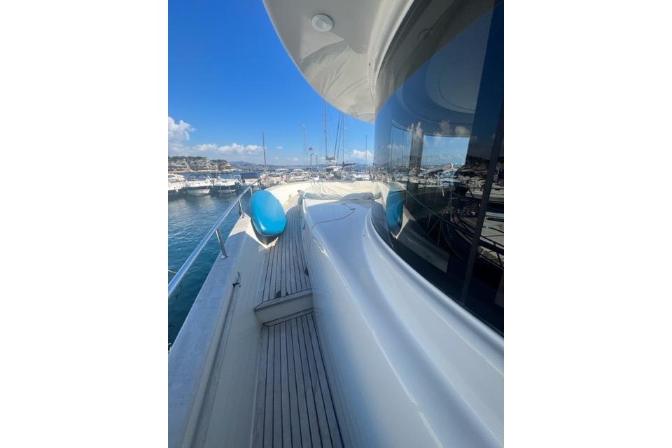 2008 Apreamare Maestro 65 yacht docked at marina, showcasing sleek design and blue skies.