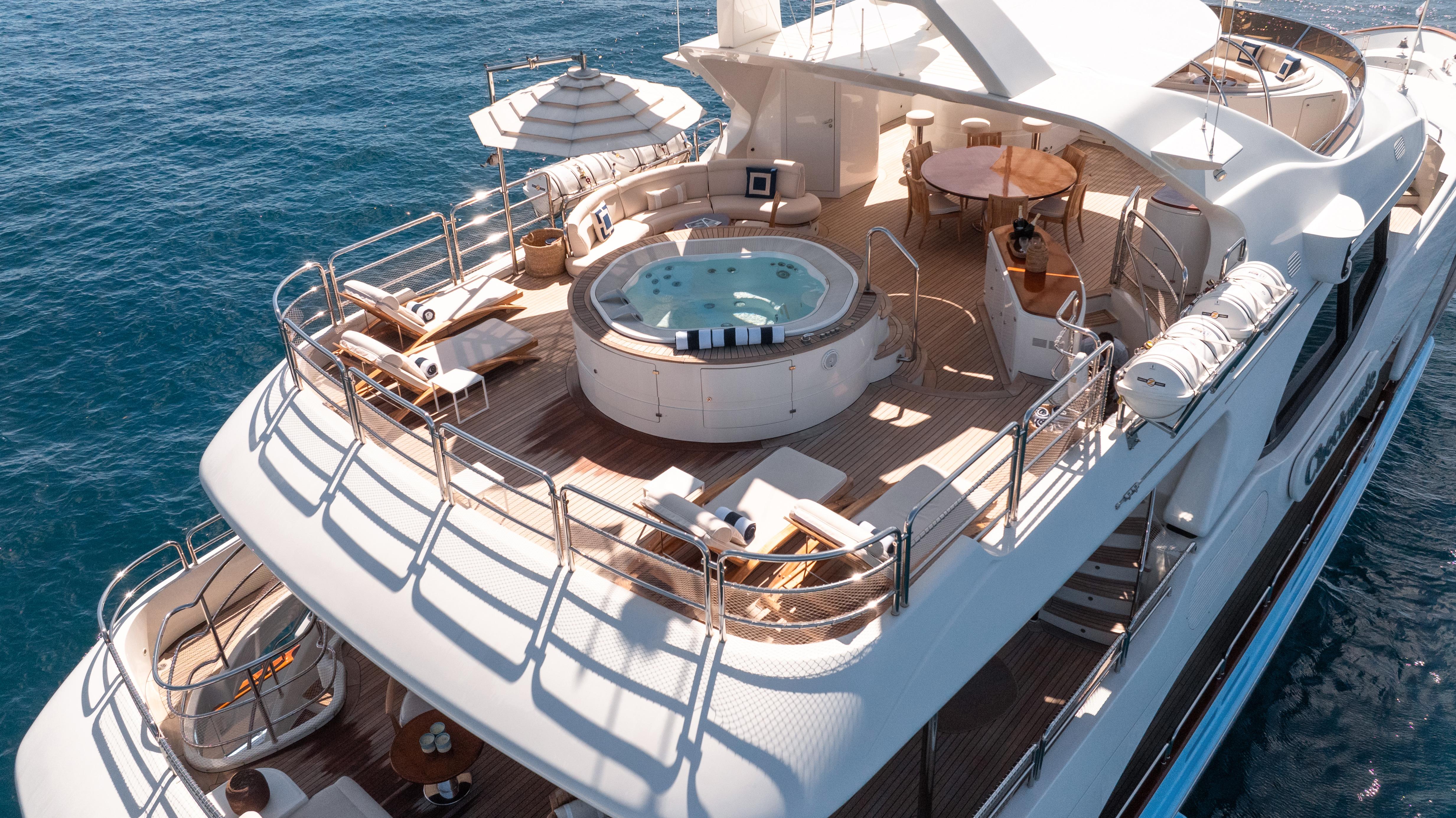Luxurious 2013 Benetti 44 yacht with jacuzzi and sun deck on open sea.