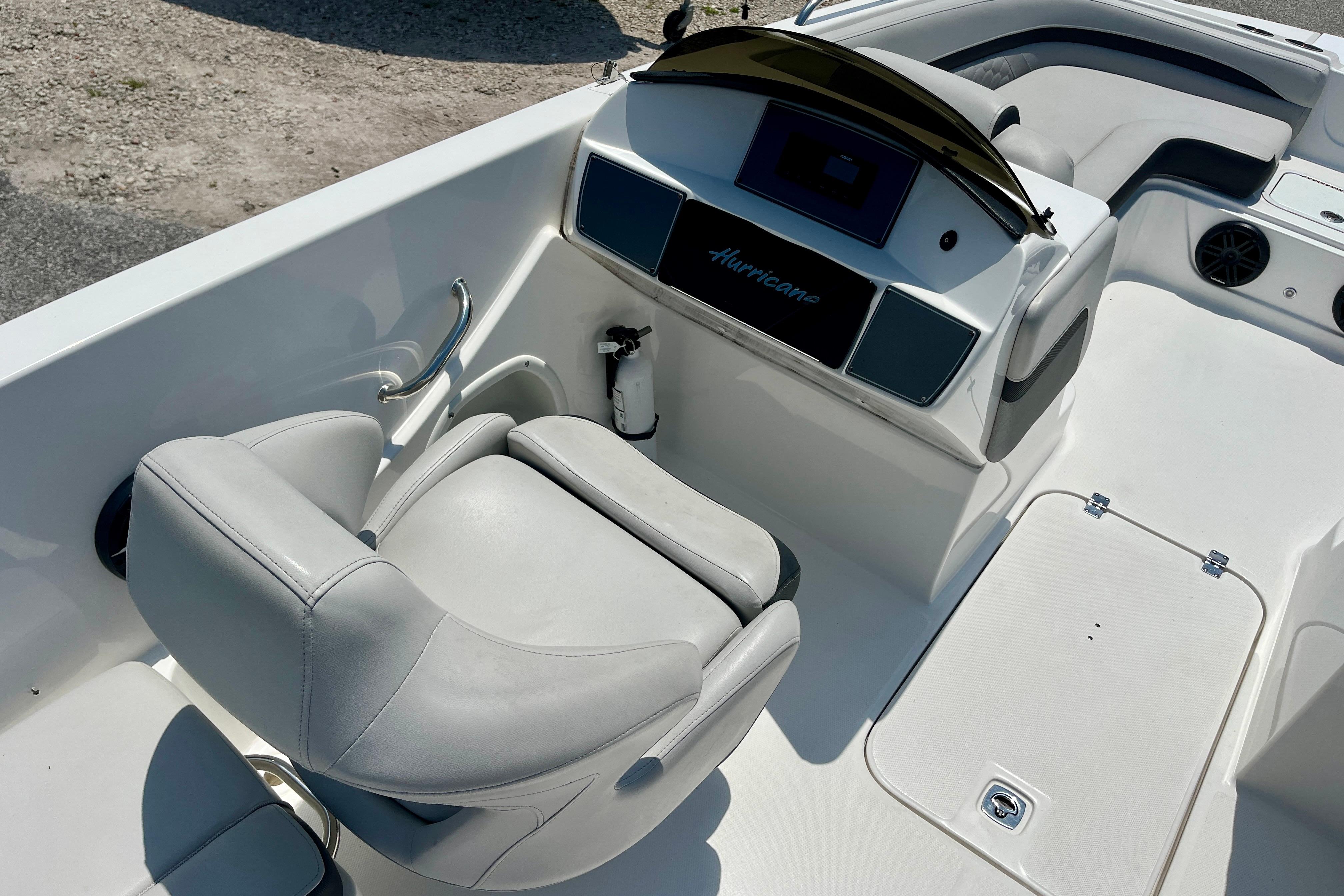 2024 Hurricane Sundeck Sport 218 OB boat interior with helm and seating area.