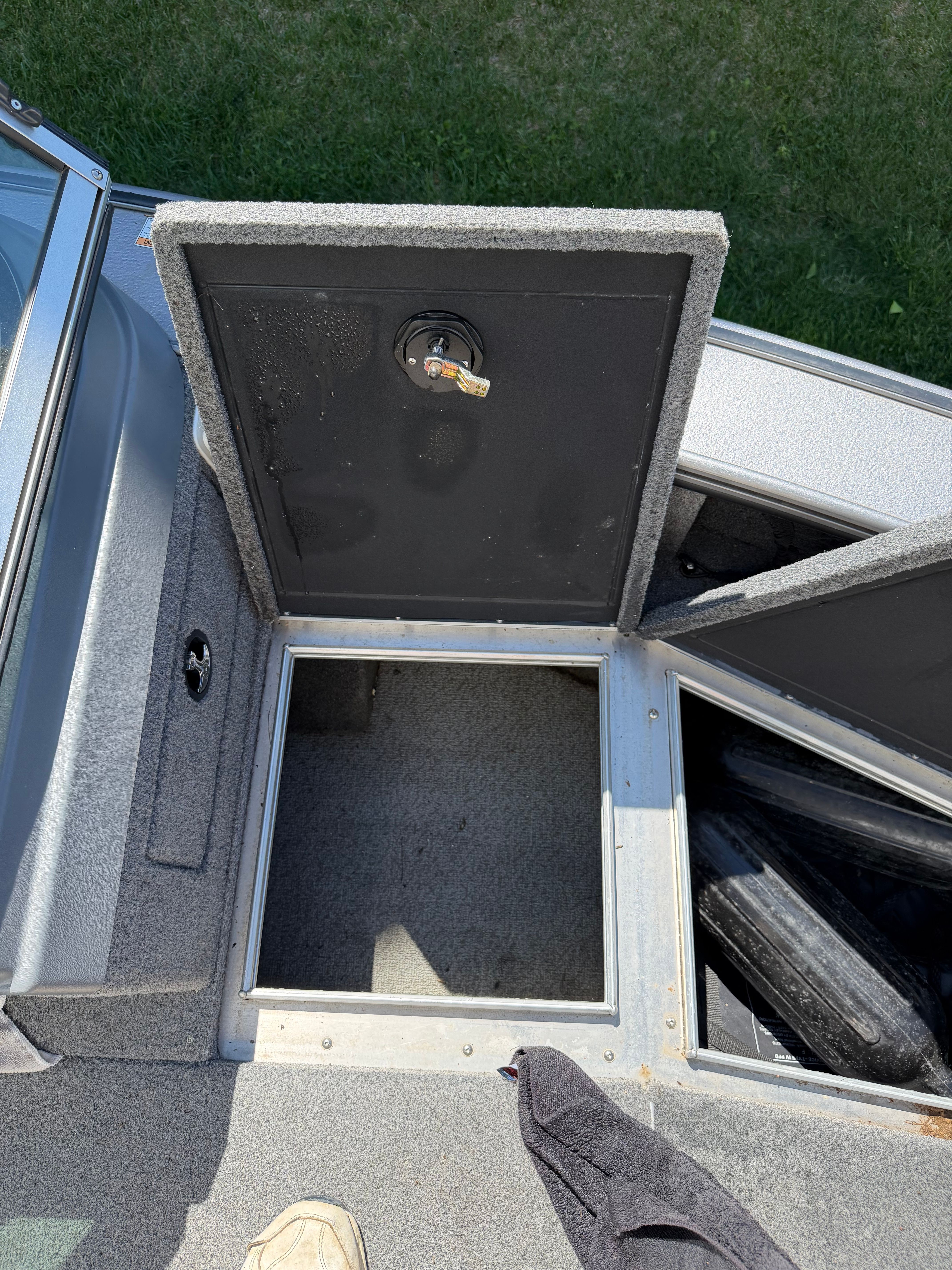 Open storage compartment on a 2017 Lund Pro V 1975 boat.