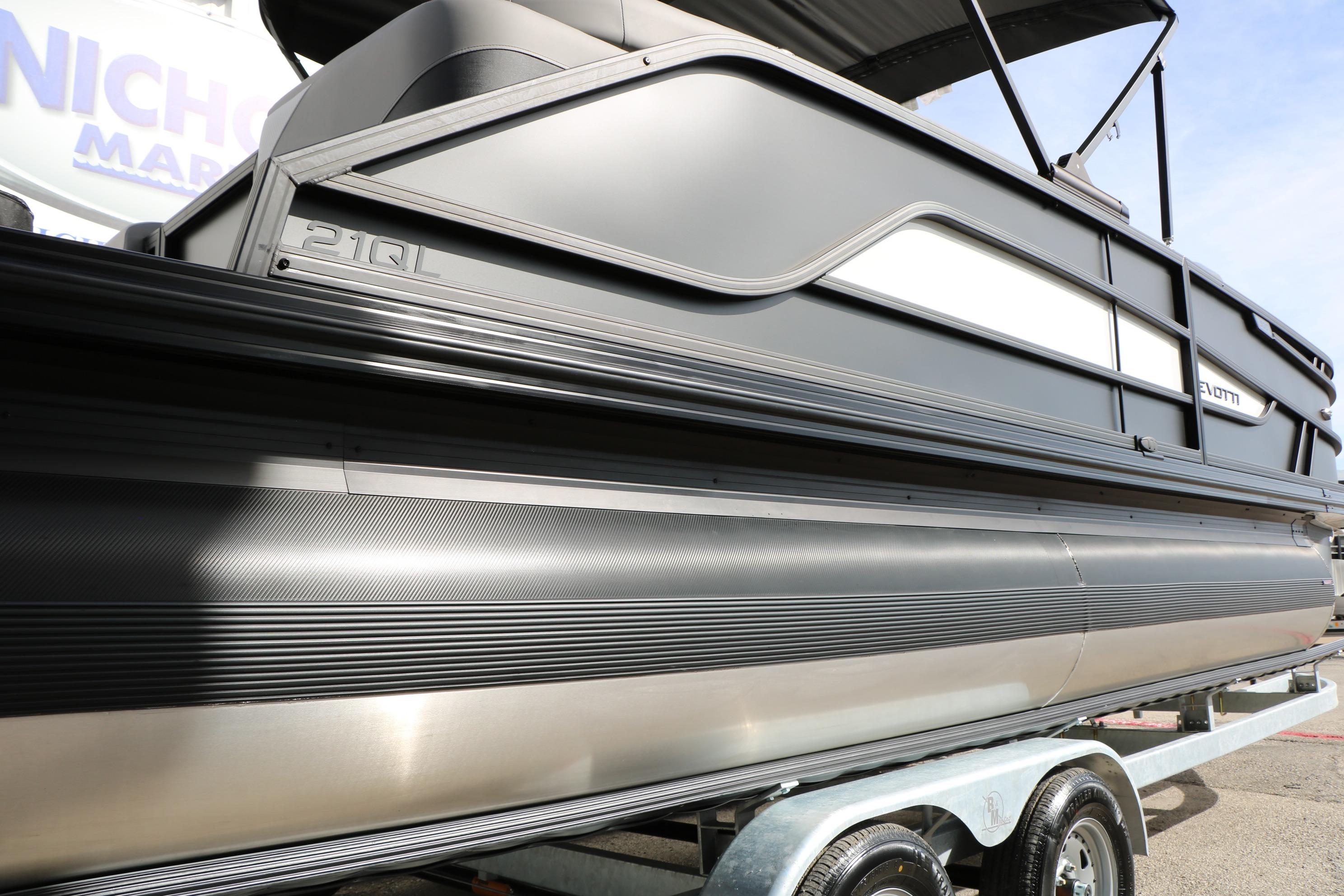 2026 Evotti 521QL pontoon boat on trailer, showcasing sleek design and modern features.