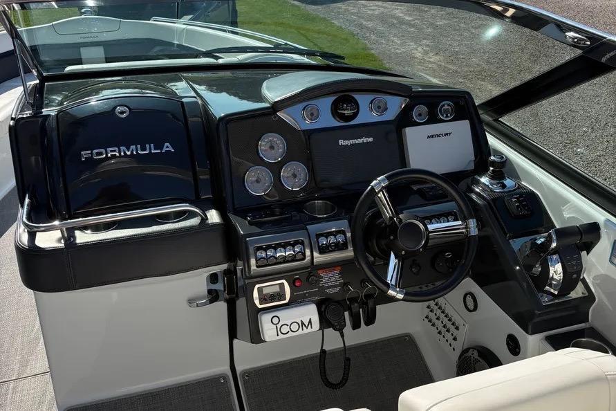 2015 Formula 350 Crossover Bowrider dashboard with steering wheel and navigation controls.
