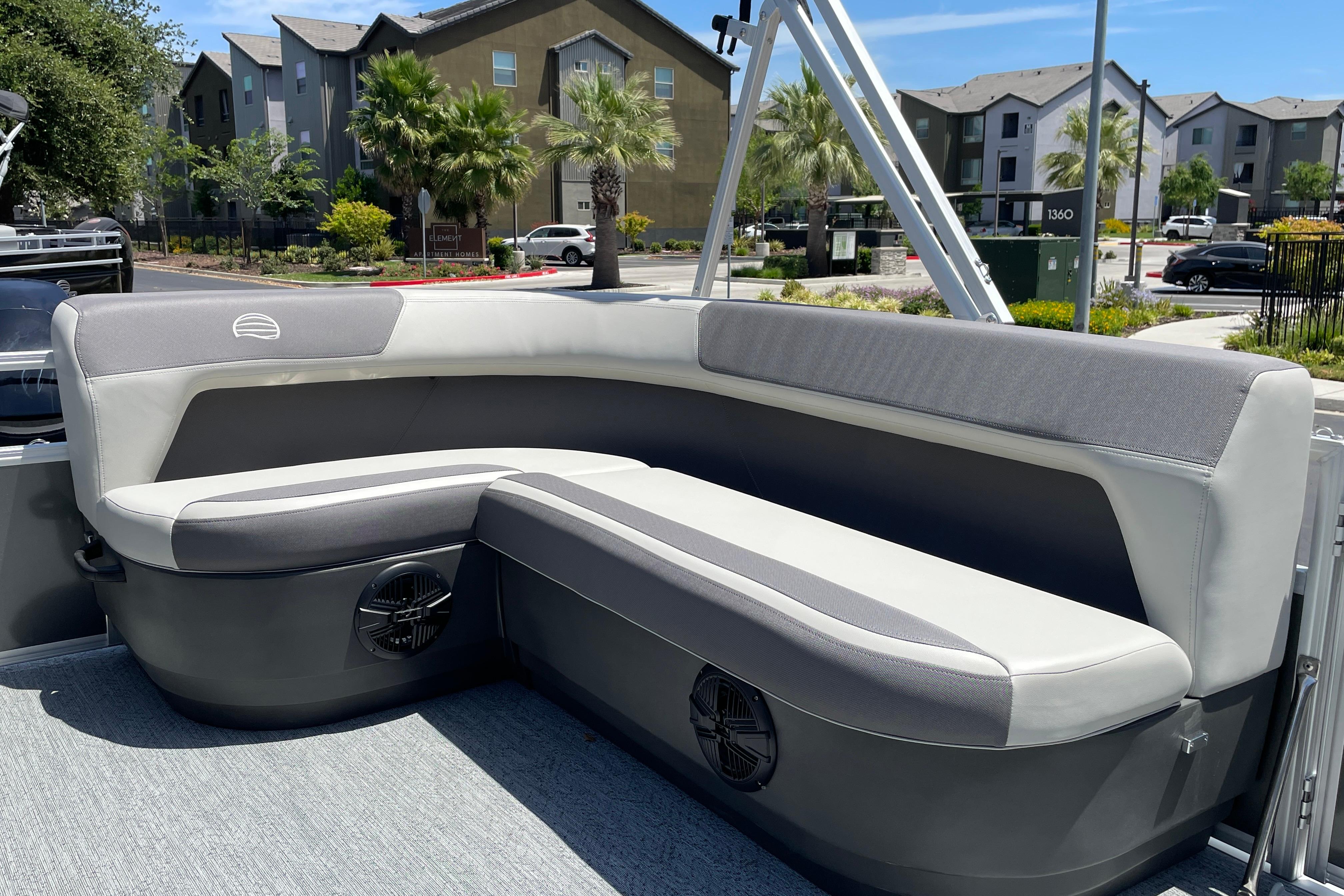 2026 Sun Tracker Bass Buggy 16 XL Select pontoon boat with cushioned seating.