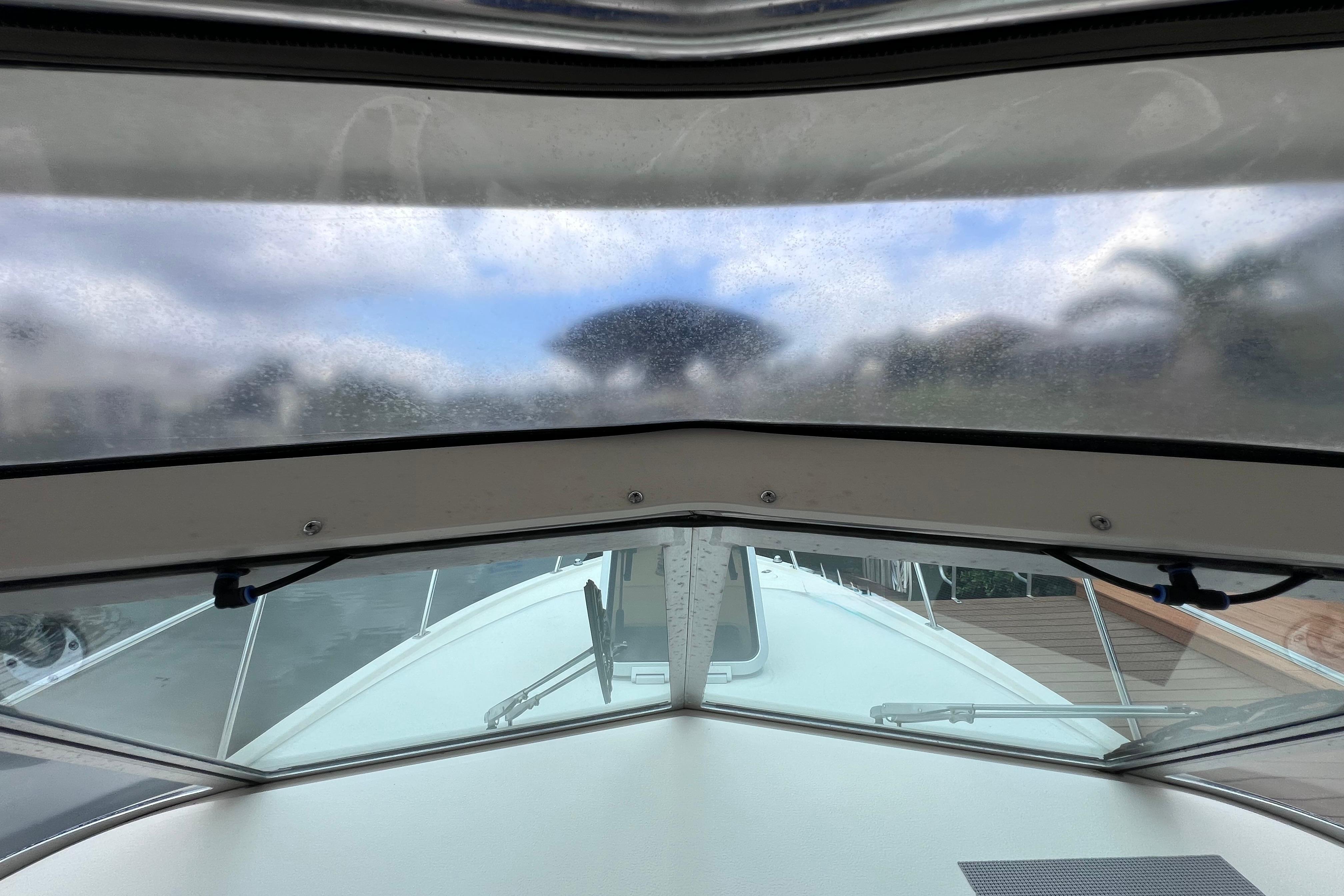 View from inside a 2005 Pursuit 3070 Offshore boat, looking through the windshield.