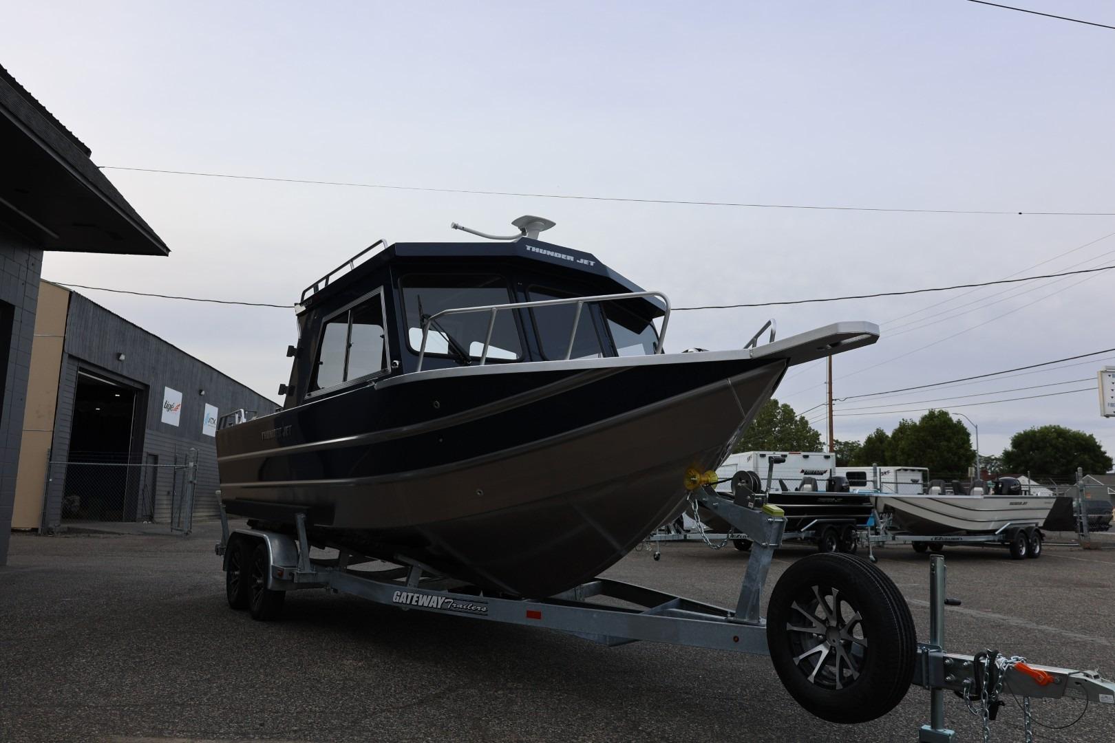 2026 Thunder Jet 24 Alexis Pro boat on trailer in outdoor setting.