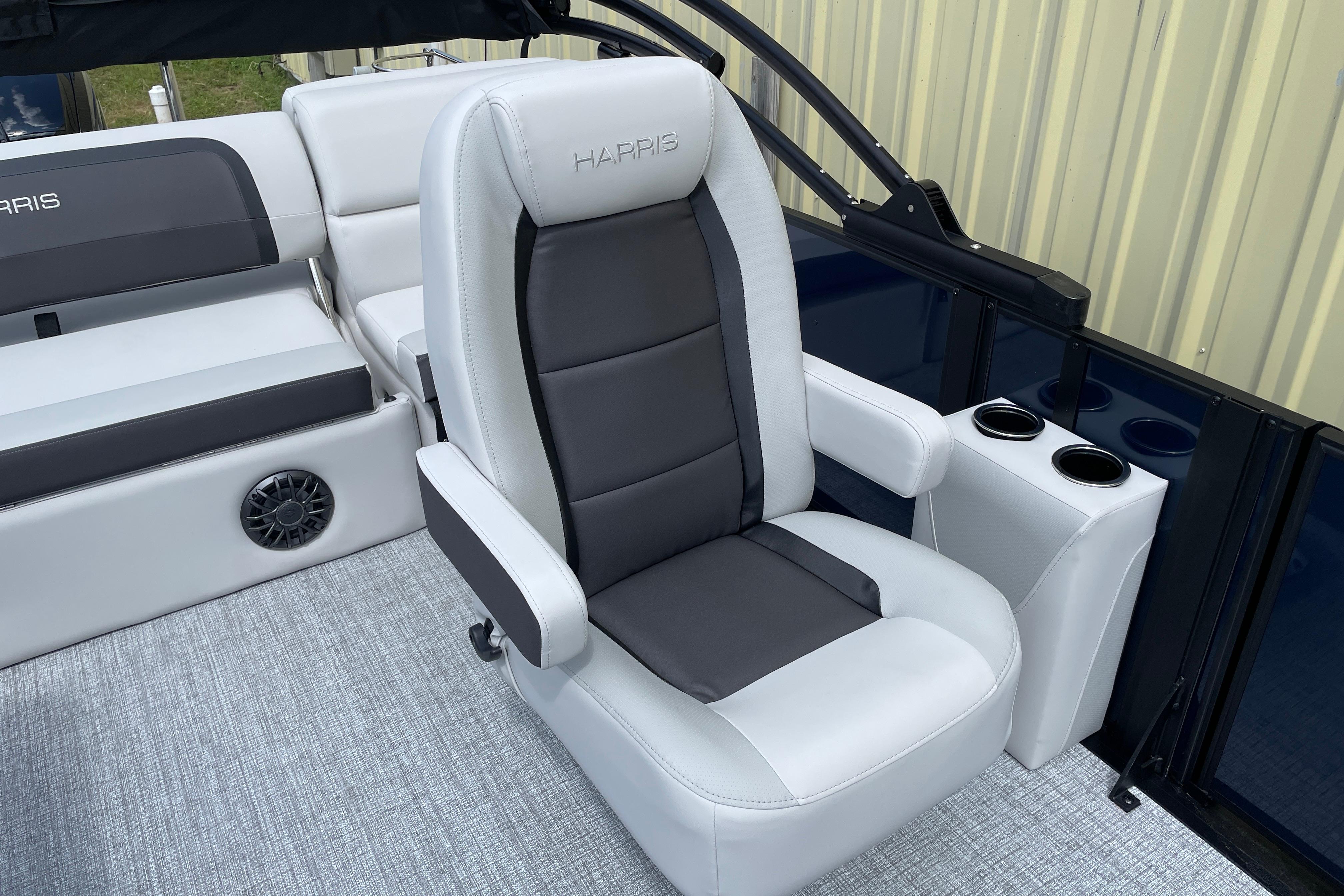 2026 Harris Cruiser 210 SLDH boat interior with luxurious seating and cup holders.