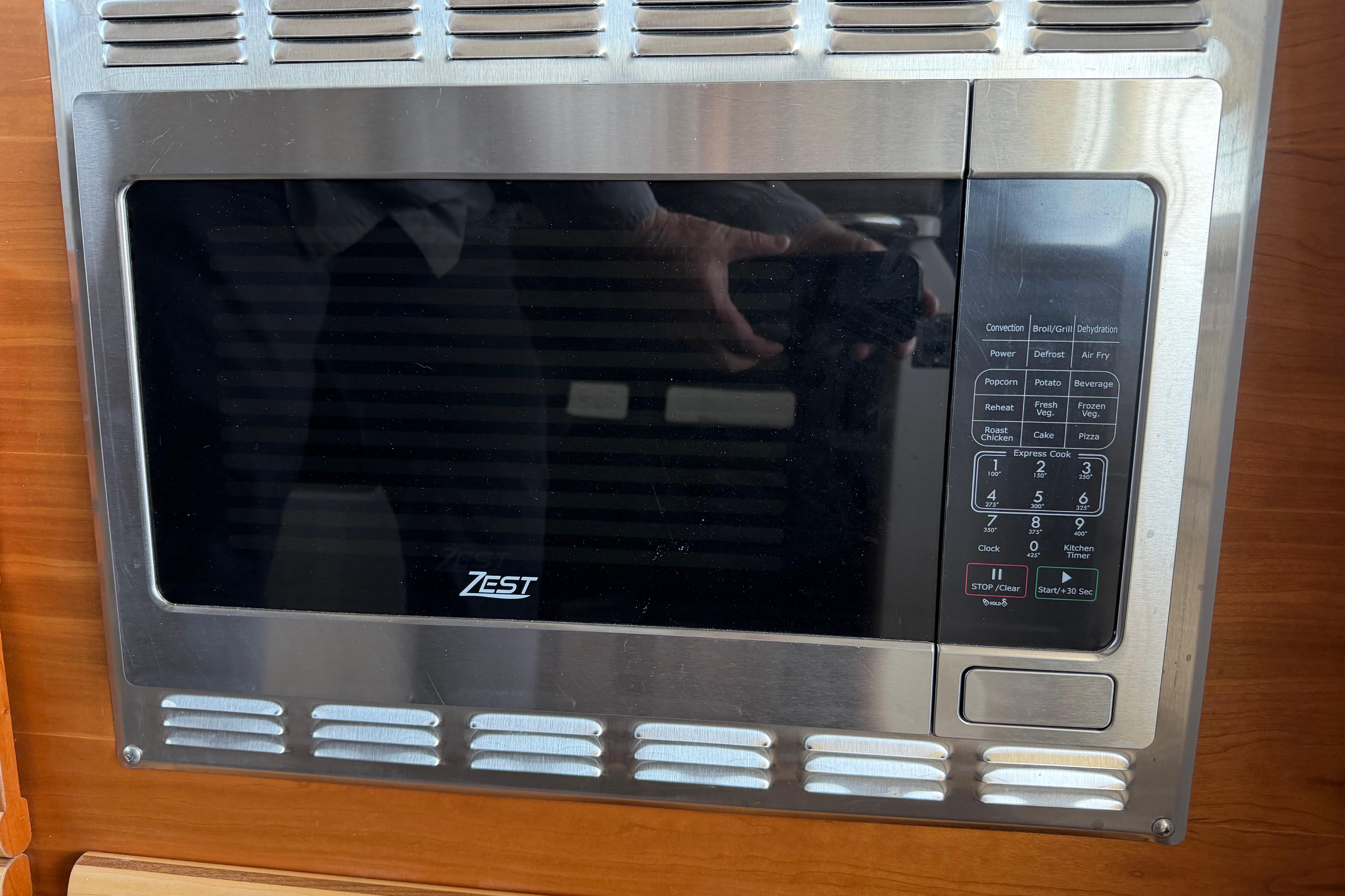 Built-in Zest microwave in 2023 Cutwater C-288 Coupe boat kitchen.