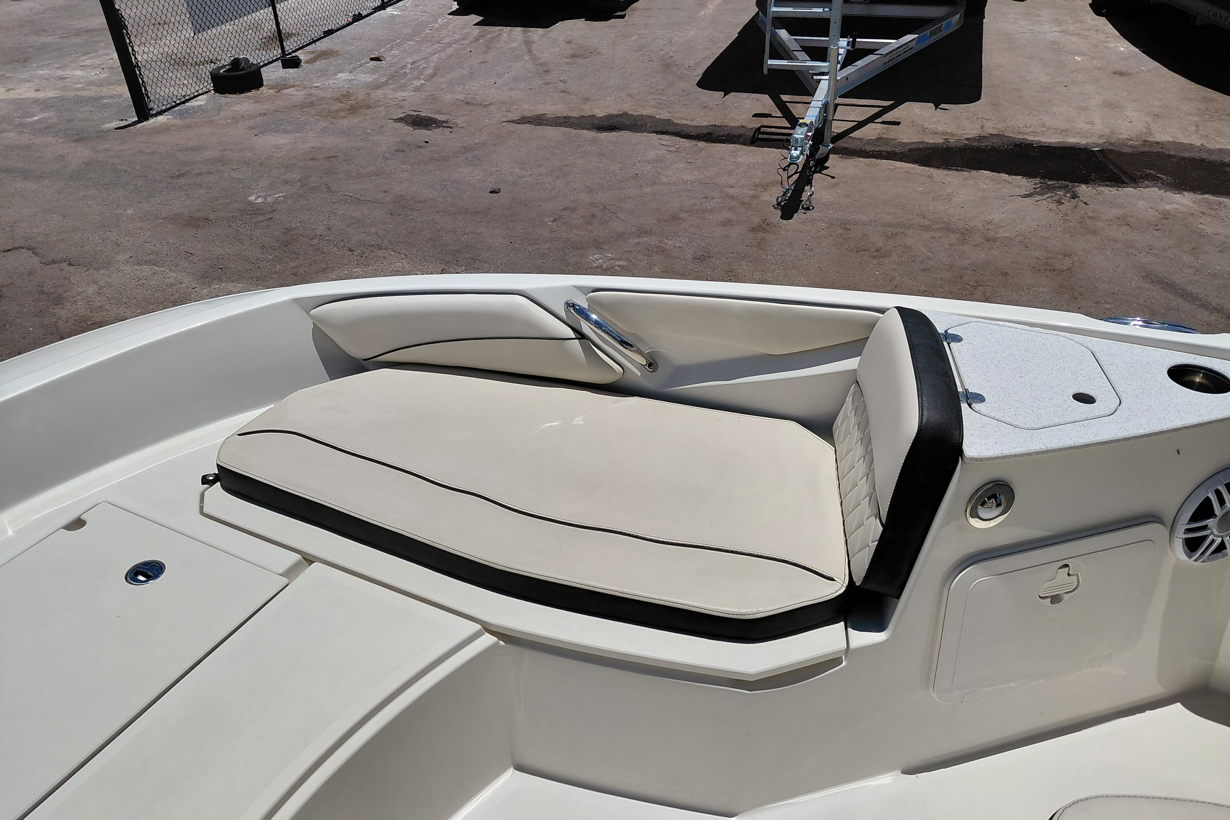 2023 Stingray 206 CC boat interior with cushioned seating and storage compartments.