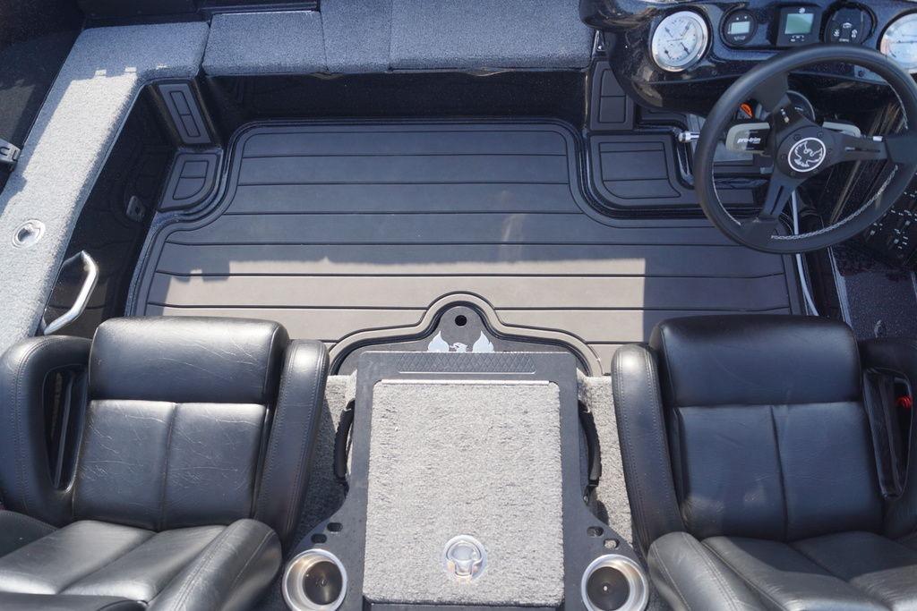 Interior of 2025 Phoenix 921 Elite boat with black leather seats and modern dashboard.