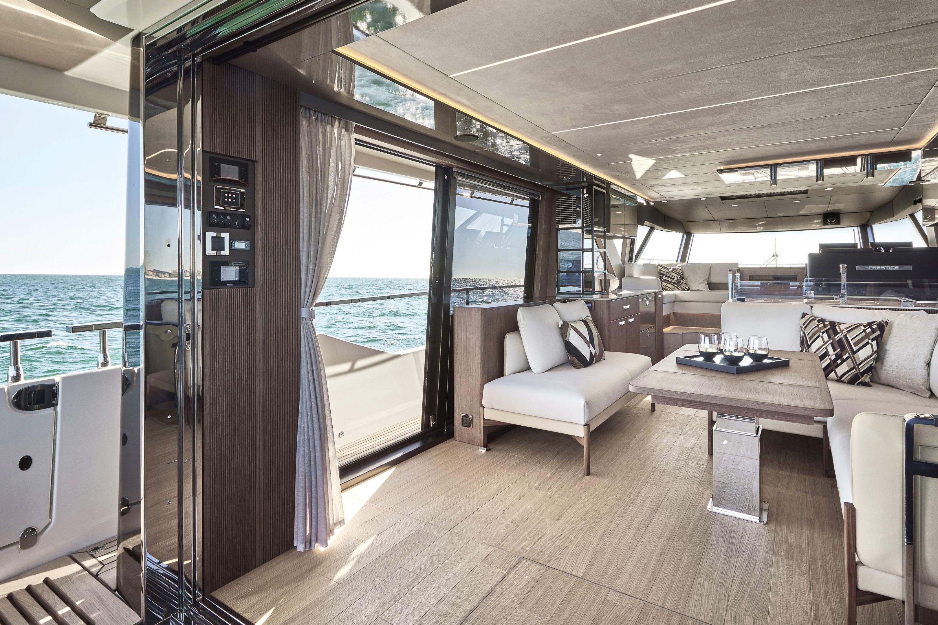Luxurious interior of 2026 Prestige X60 yacht with elegant seating and ocean view.