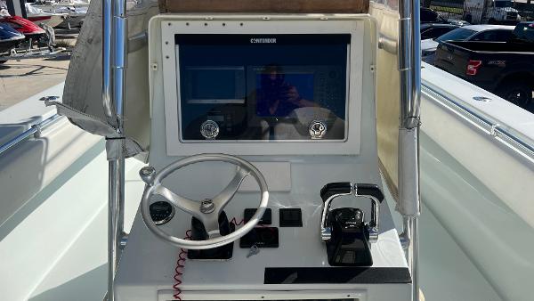 2005 Contender 36 Open boat helm with steering wheel and controls.
