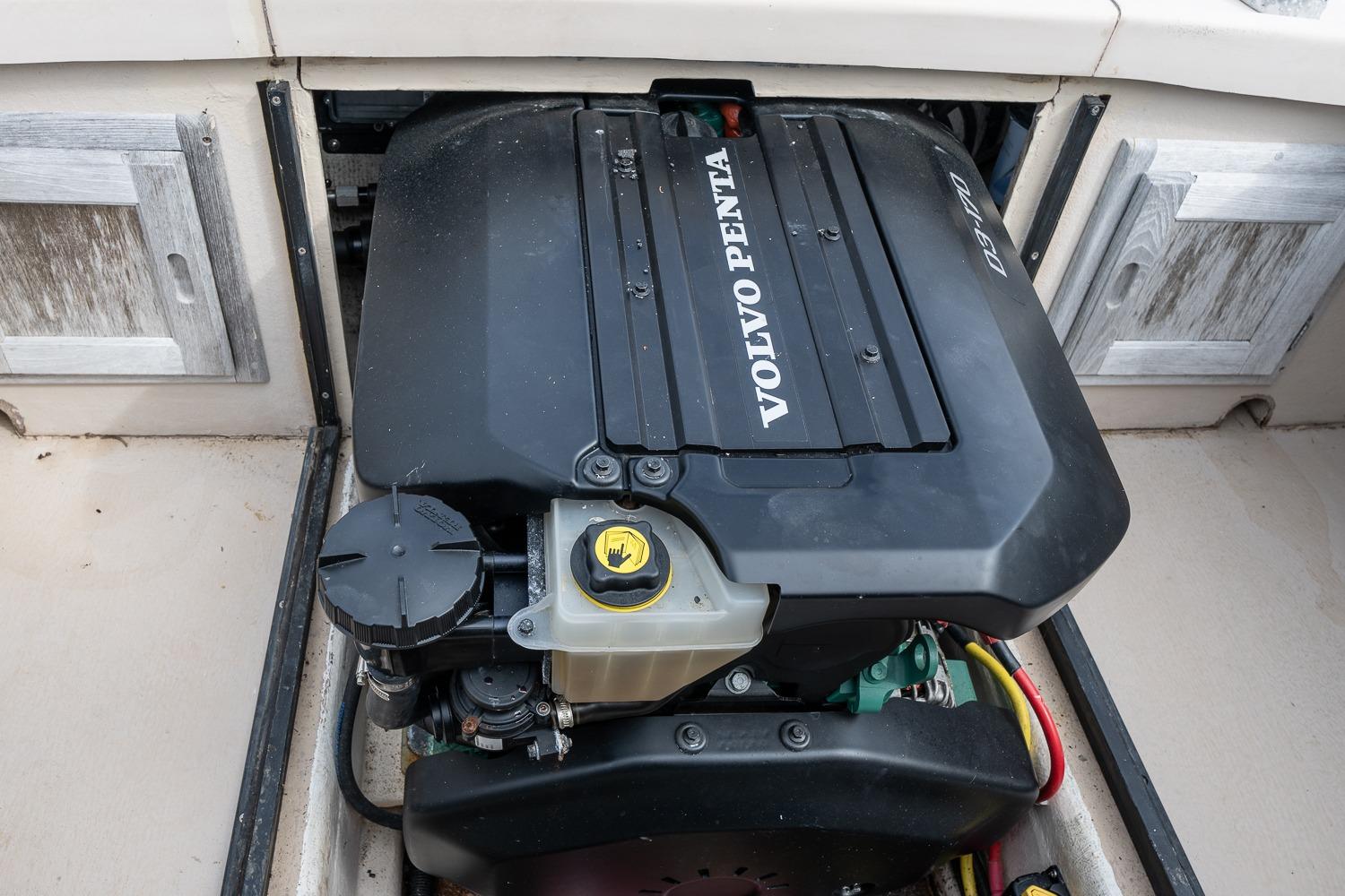 Volvo Penta engine in 1989 Ellis 24 Open boat, showcasing marine power.