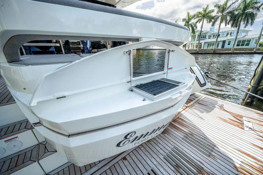 2024 Galeon 500 Fly yacht with outdoor grill on deck by waterfront.