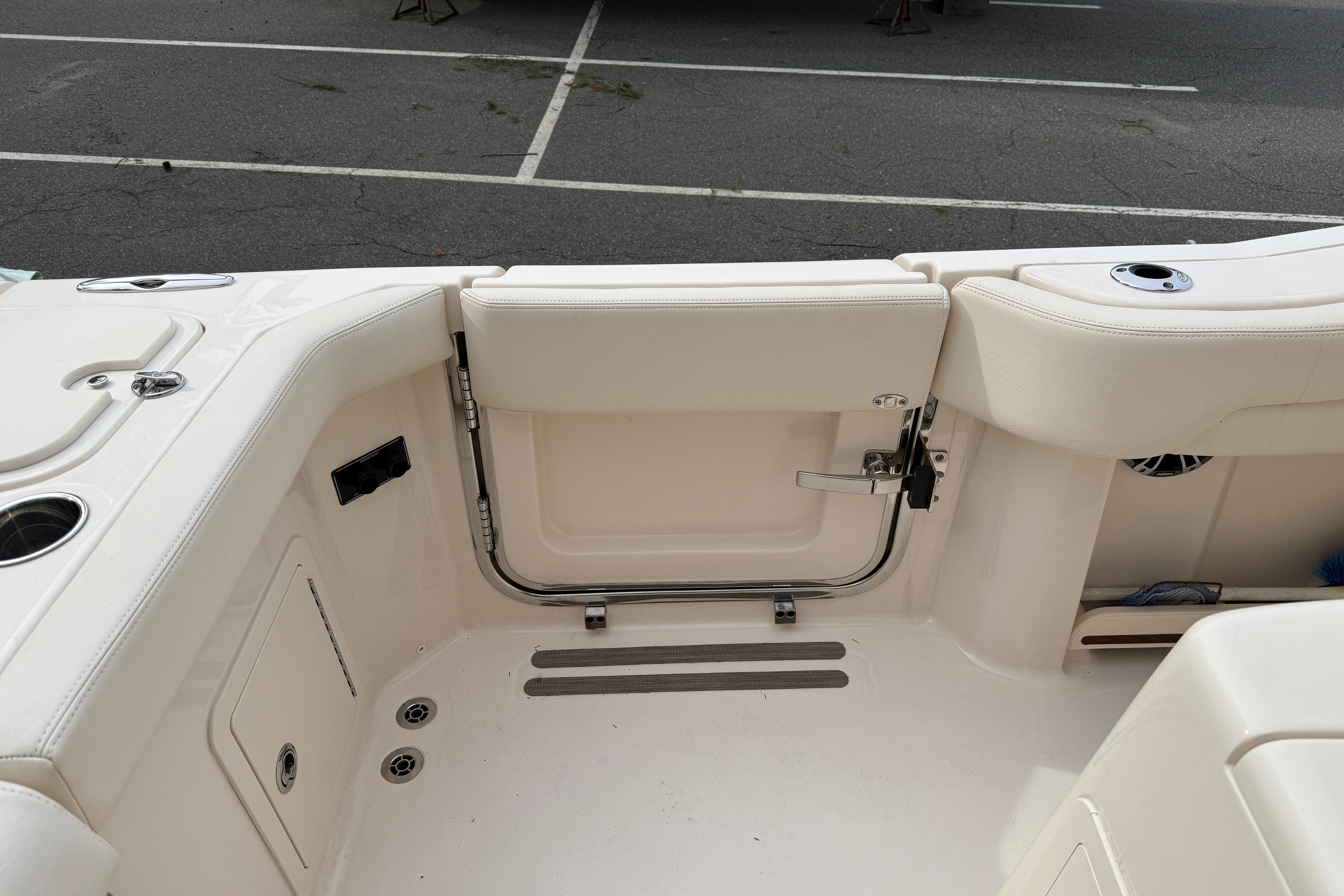 2024 Grady-White Canyon 271 boat interior, featuring sleek seating and storage compartments.