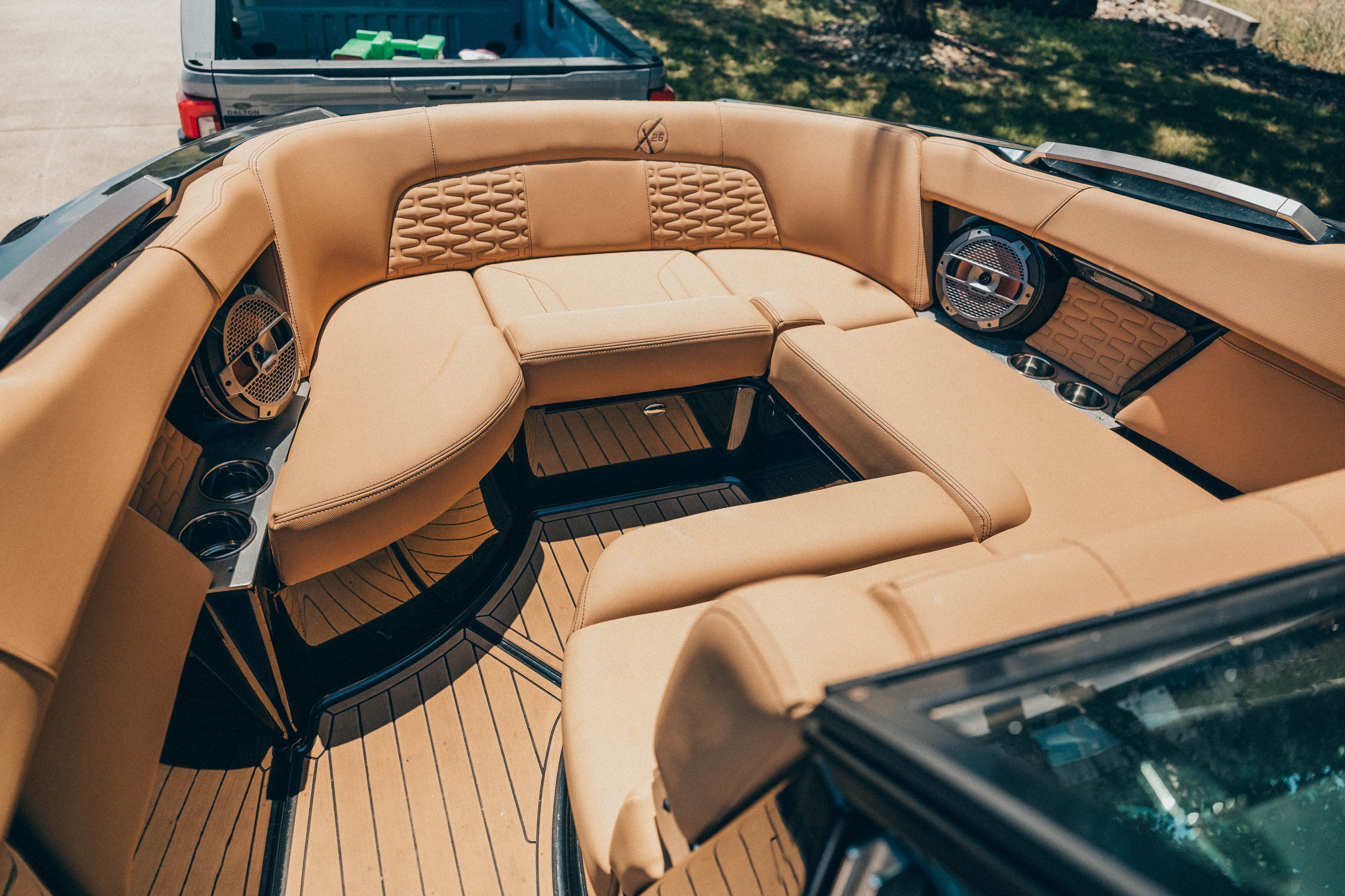 The image shows the interior of a 2021 MasterCraft X26 with luxurious beige upholstery.