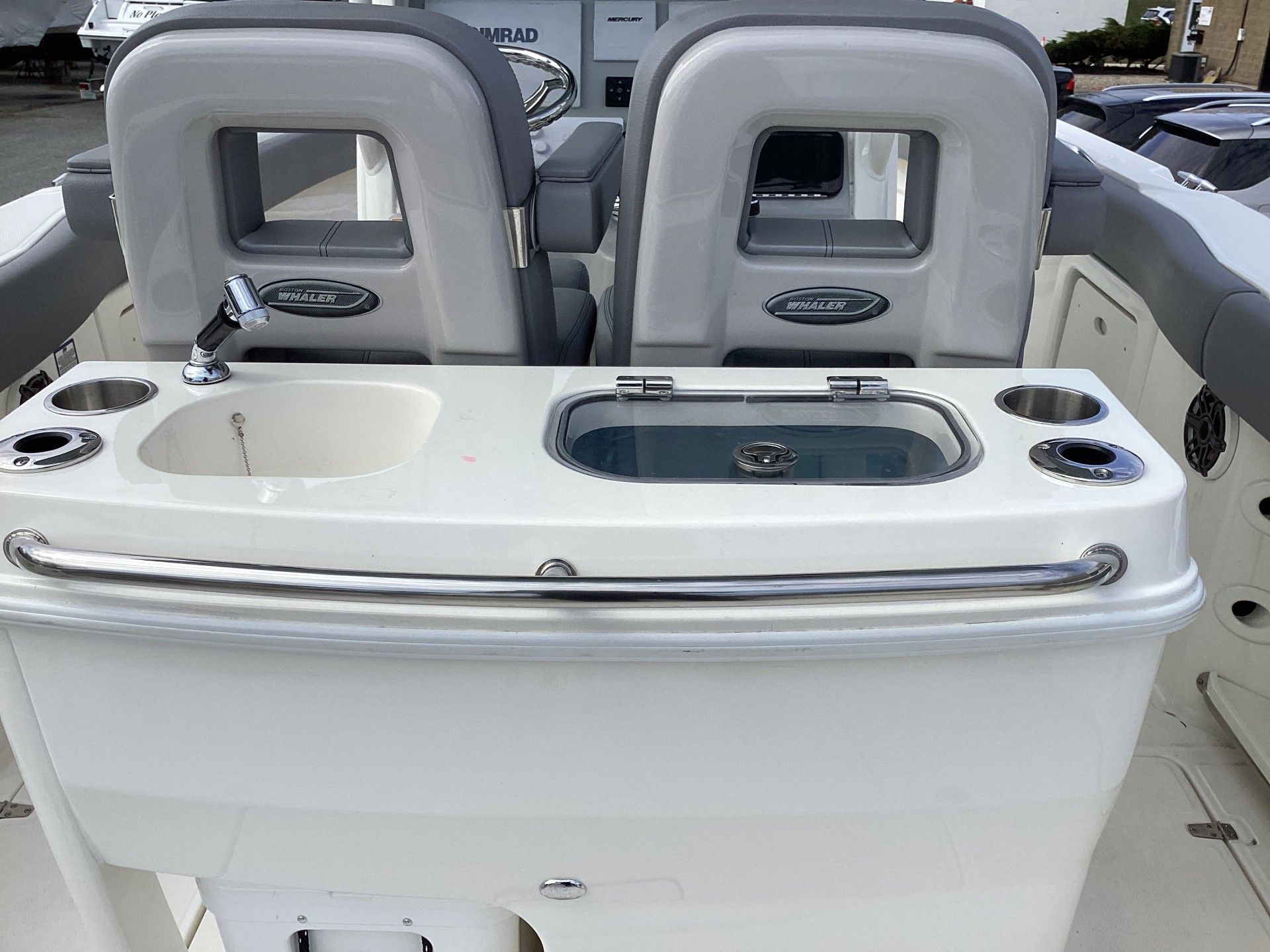 2023 Boston Whaler 280 boat interior with sink and storage.