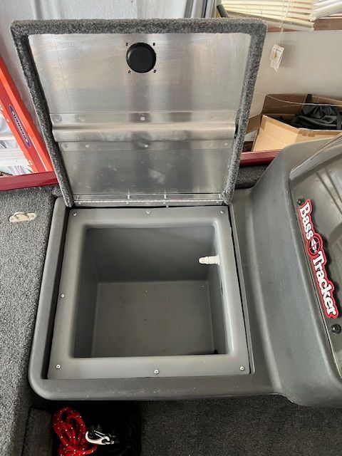 Bass Tracker Classic XL 2022 storage compartment with open lid.
