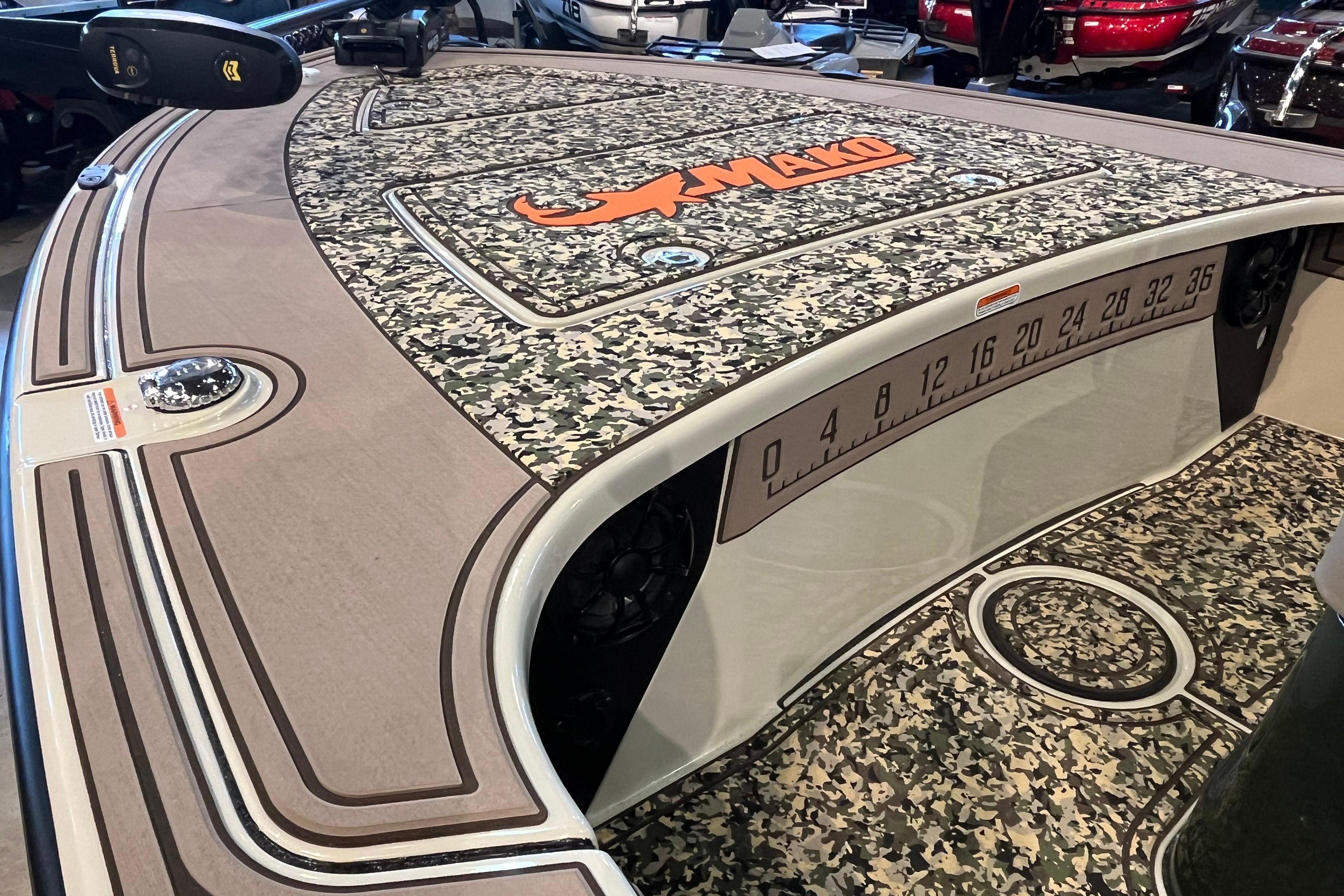 2025 Mako 18 Pro Skiff Backwater Edition with camo deck and measurement markings.