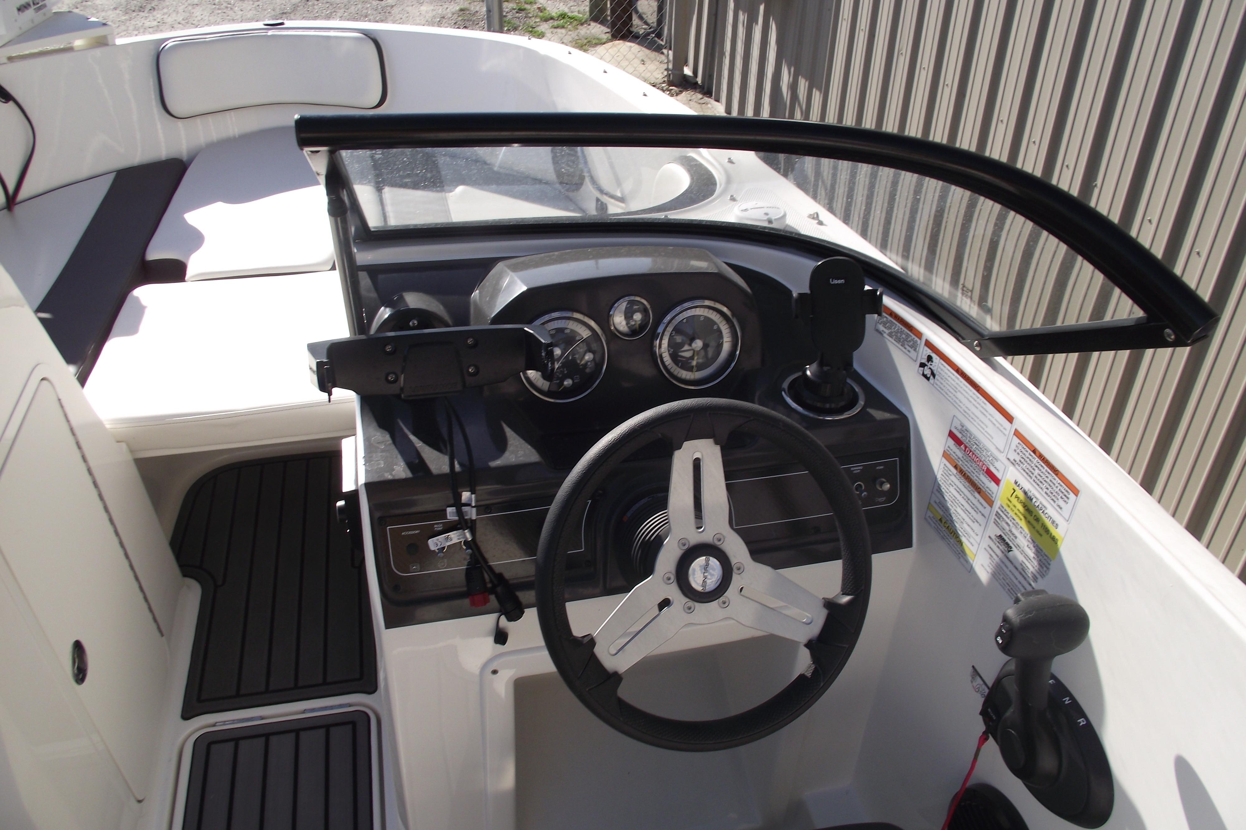 2022 Bayliner VR4 Bowrider OB cockpit with steering wheel and dashboard controls.
