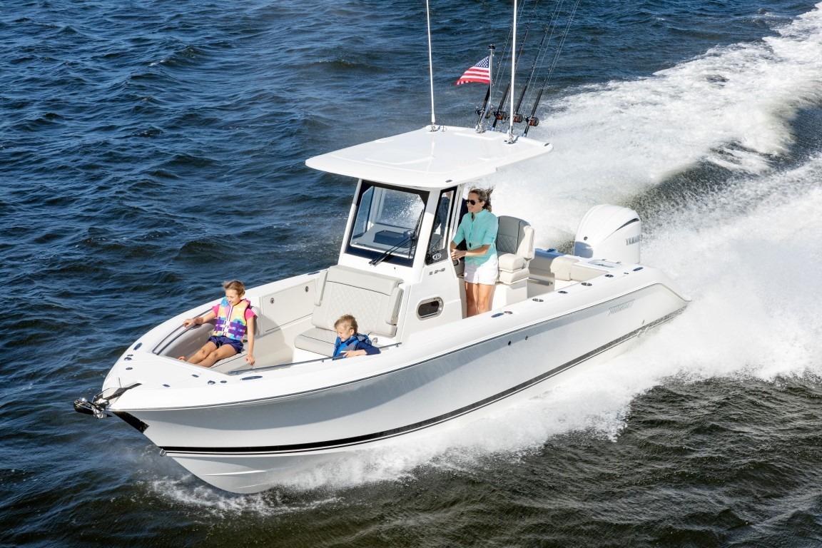 2026 Pursuit S 248 Sport boat cruising on open water with passengers.
