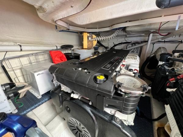 Engine room of a 2009 Ovation 52 yacht with visible machinery and components.
