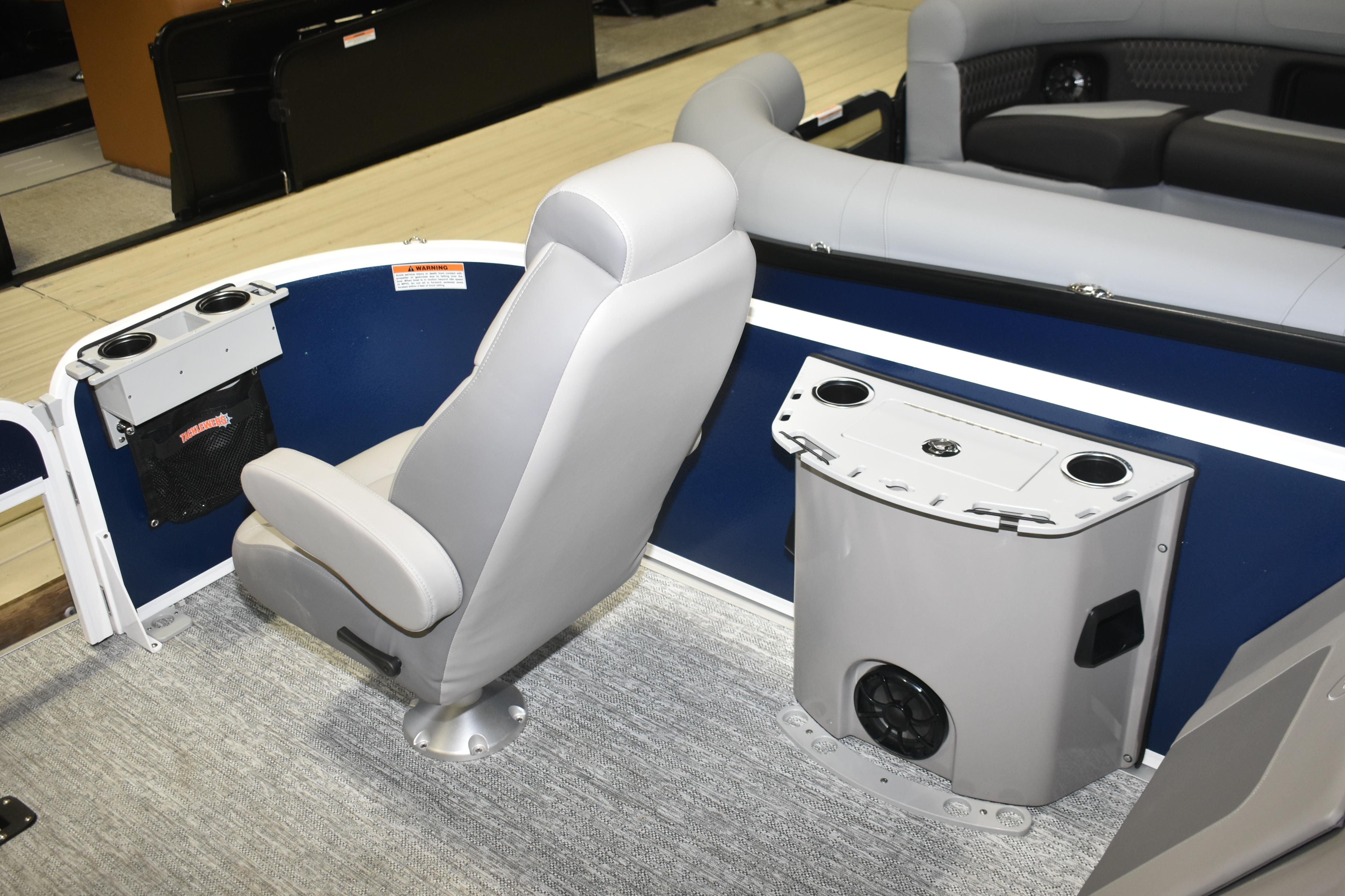 2026 Premier 230 Sunsation Angler 4PT boat interior with seating and cup holders.