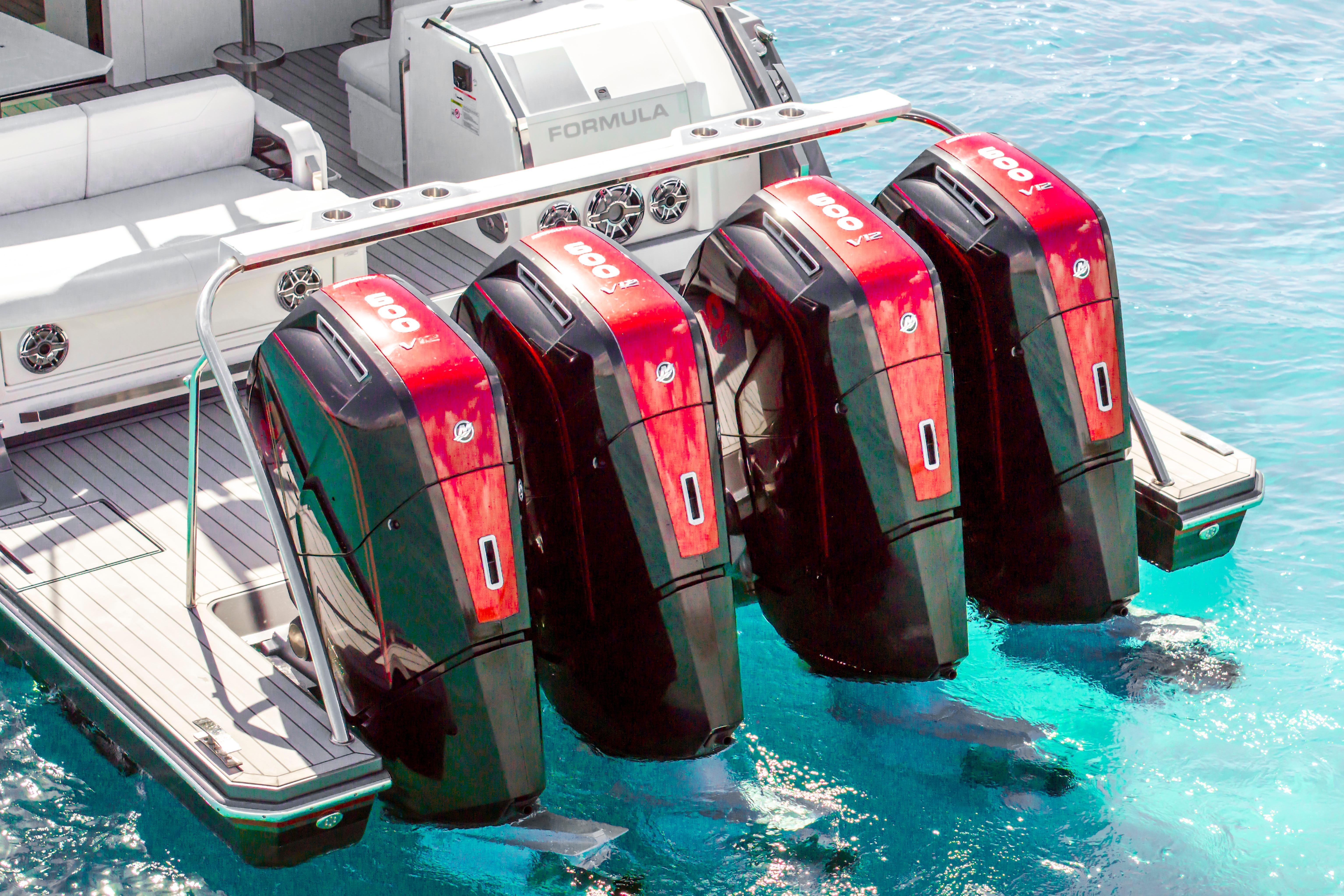 2022 Formula 500 Super Sport Crossover with four powerful outboard engines on clear blue water.