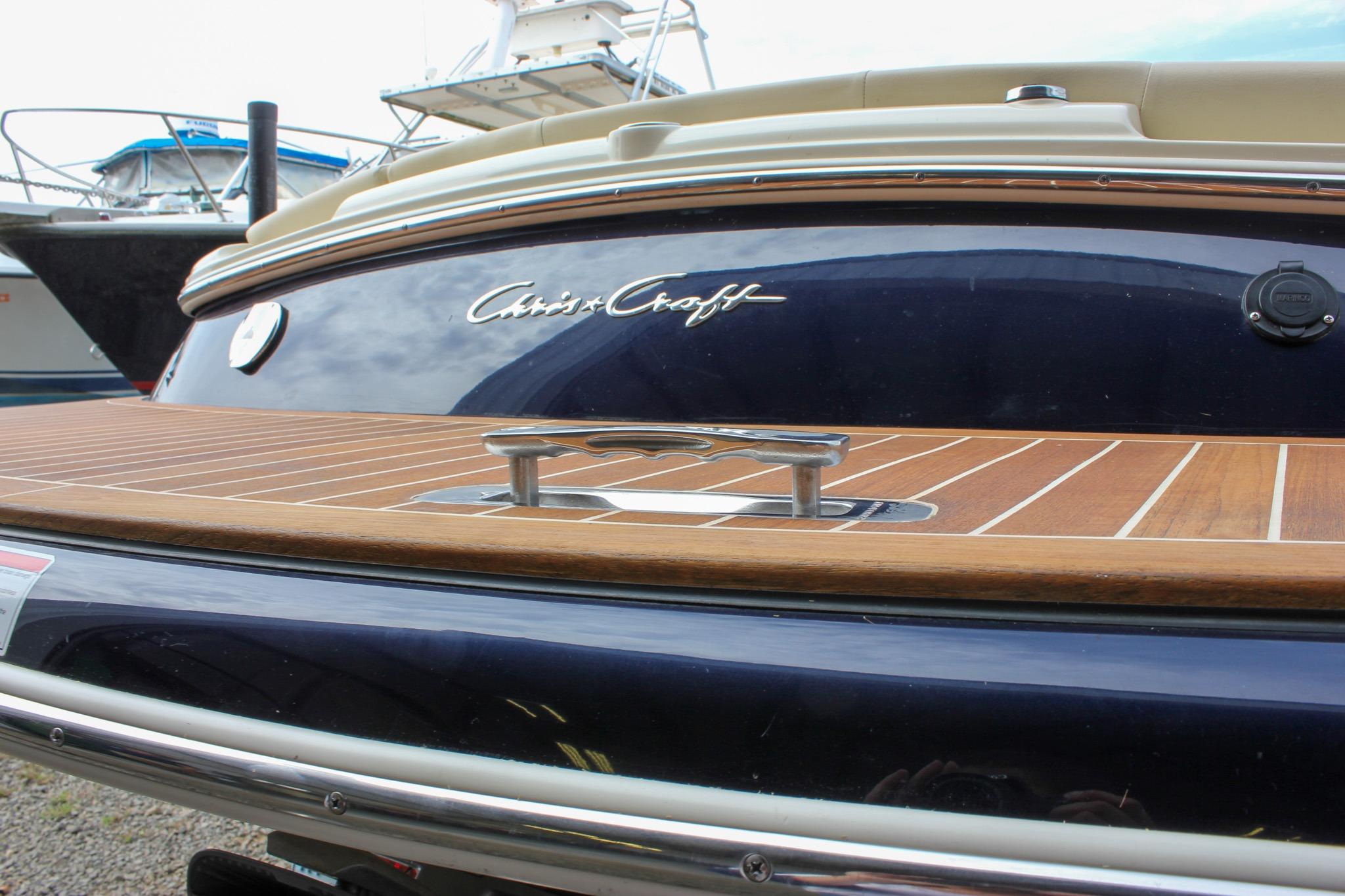 2017 Chris-Craft Capri 27 boat with teak deck and elegant design.