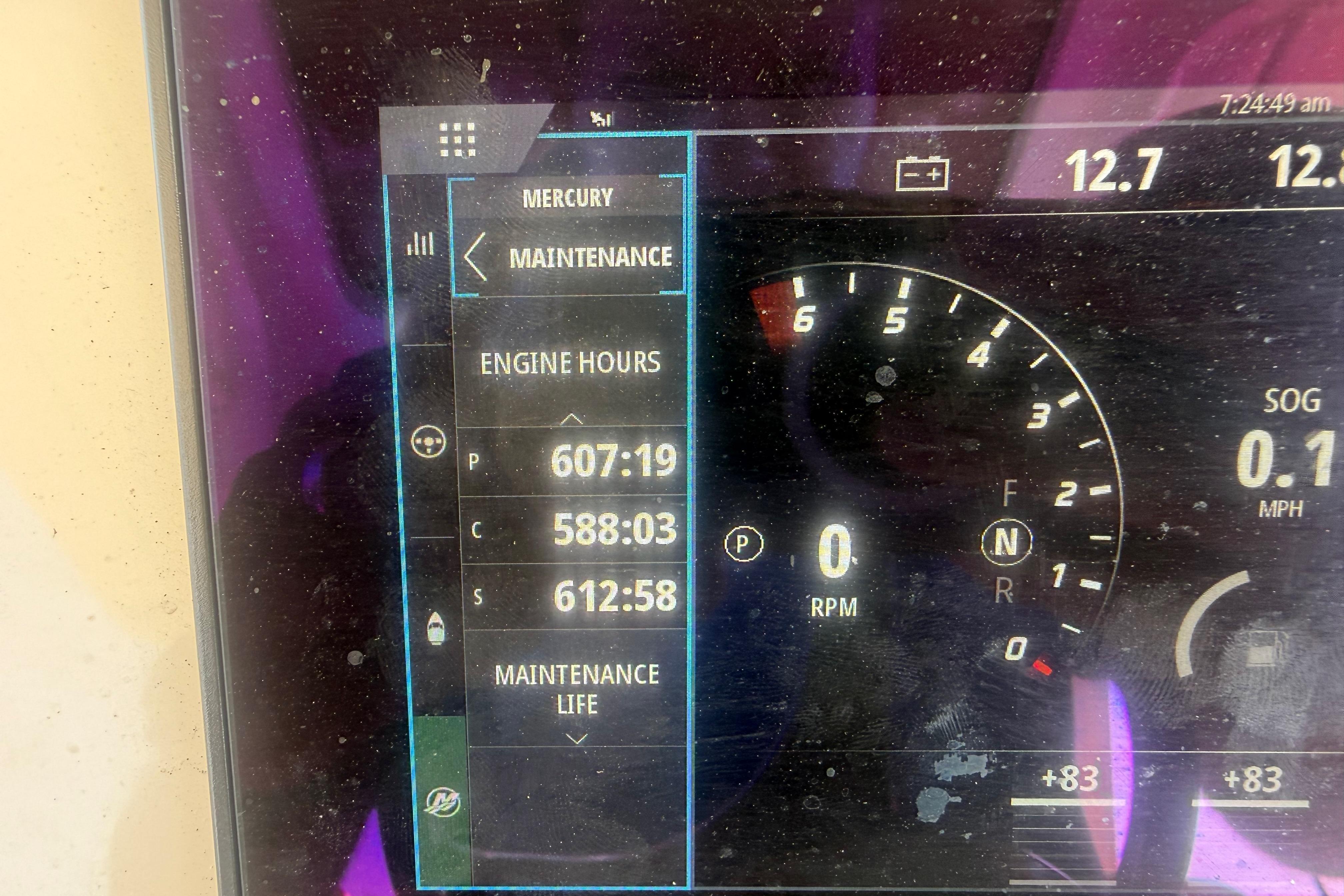 Display screen showing engine hours and maintenance data for 2022 Scout 355 LXF boat.