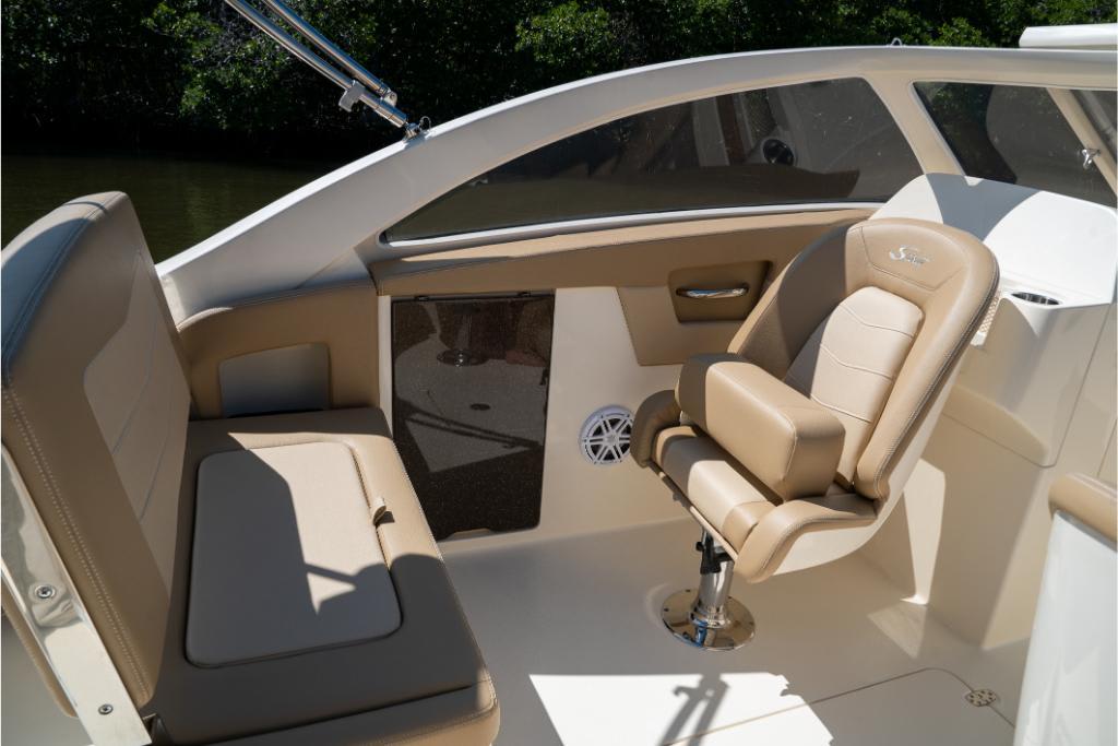 2023 Scout 240 Dorado boat interior with beige seating and modern design.