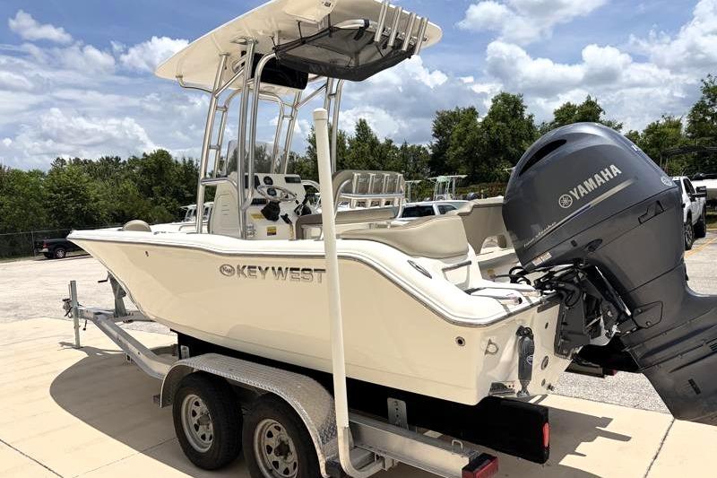 2023 Key West 203 FS boat on trailer with Yamaha outboard motor, parked outdoors.