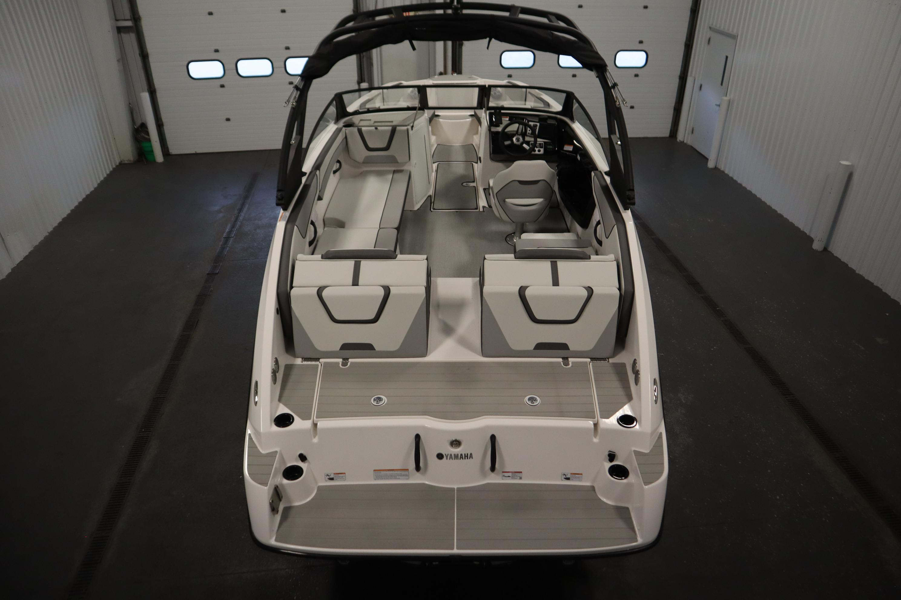 2026 Yamaha Boats AR220 interior view in a garage setting.