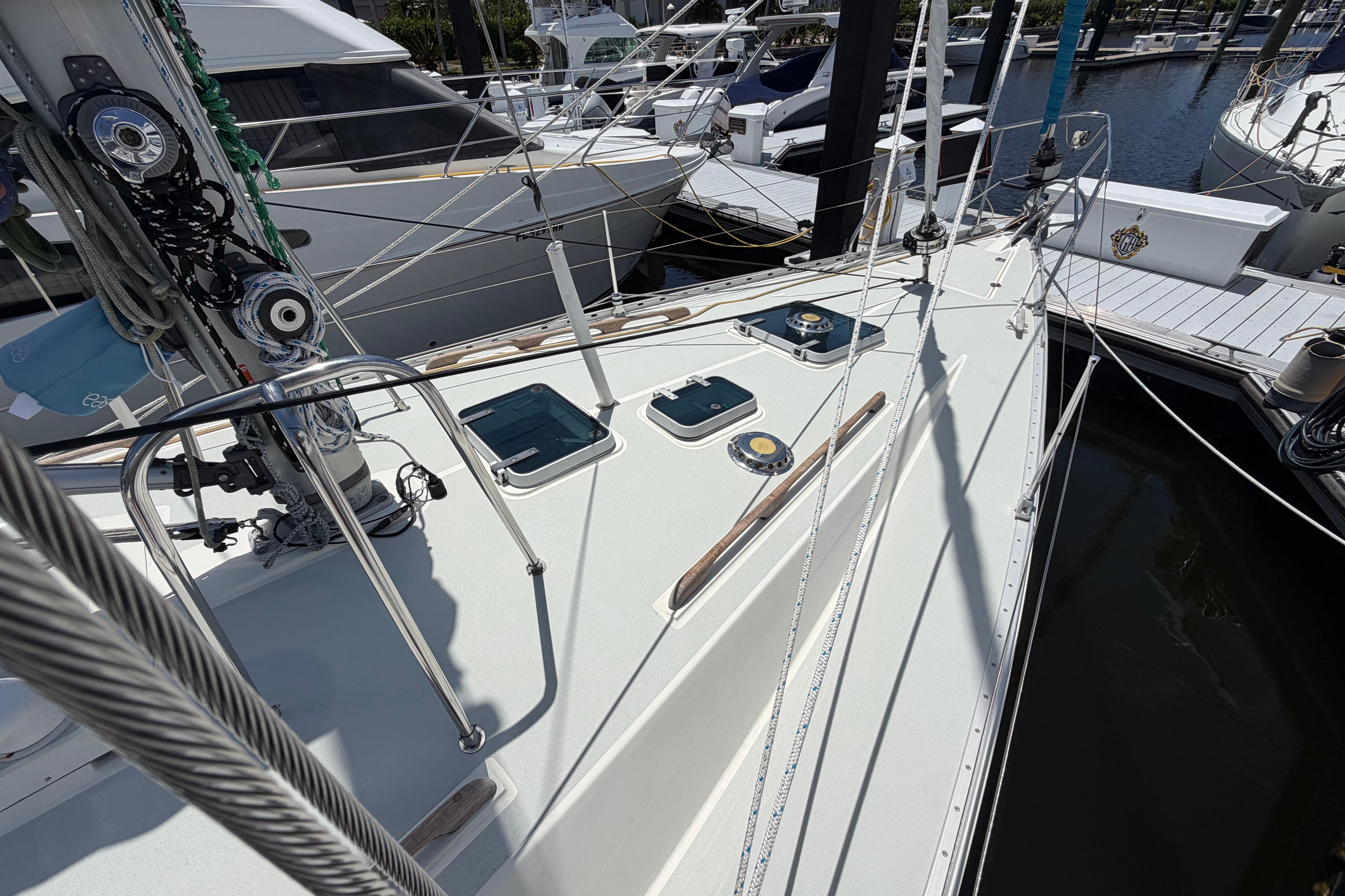 Sailboat deck view of 1987 Moody 376, docked in a marina.