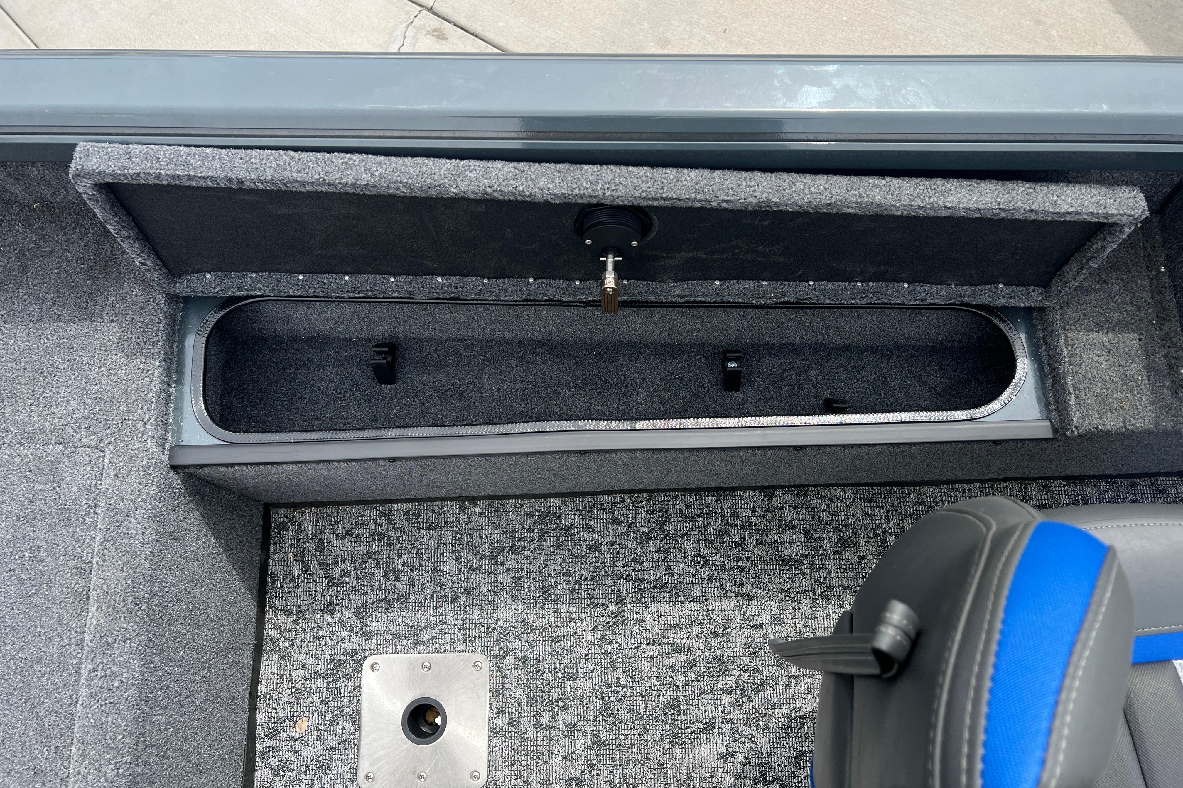 2026 Ranger VS1682SC Angler boat interior storage compartment with gray carpet and seating.
