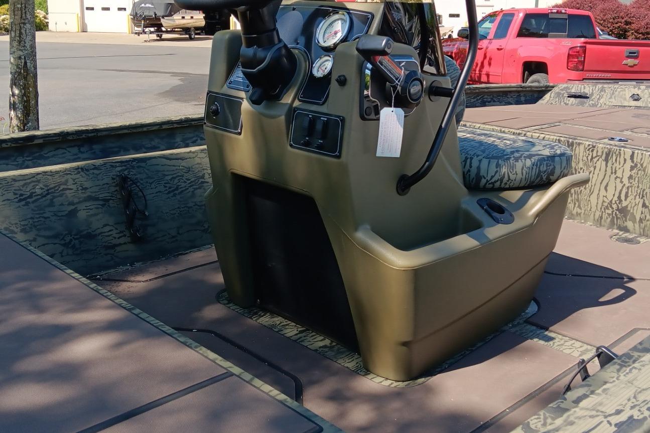 2026 Tracker Grizzly 1860 CC boat interior with steering console and gauges.
