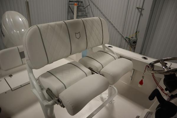 2025 Sea Fox 228 Commander boat interior with white cushioned seating.