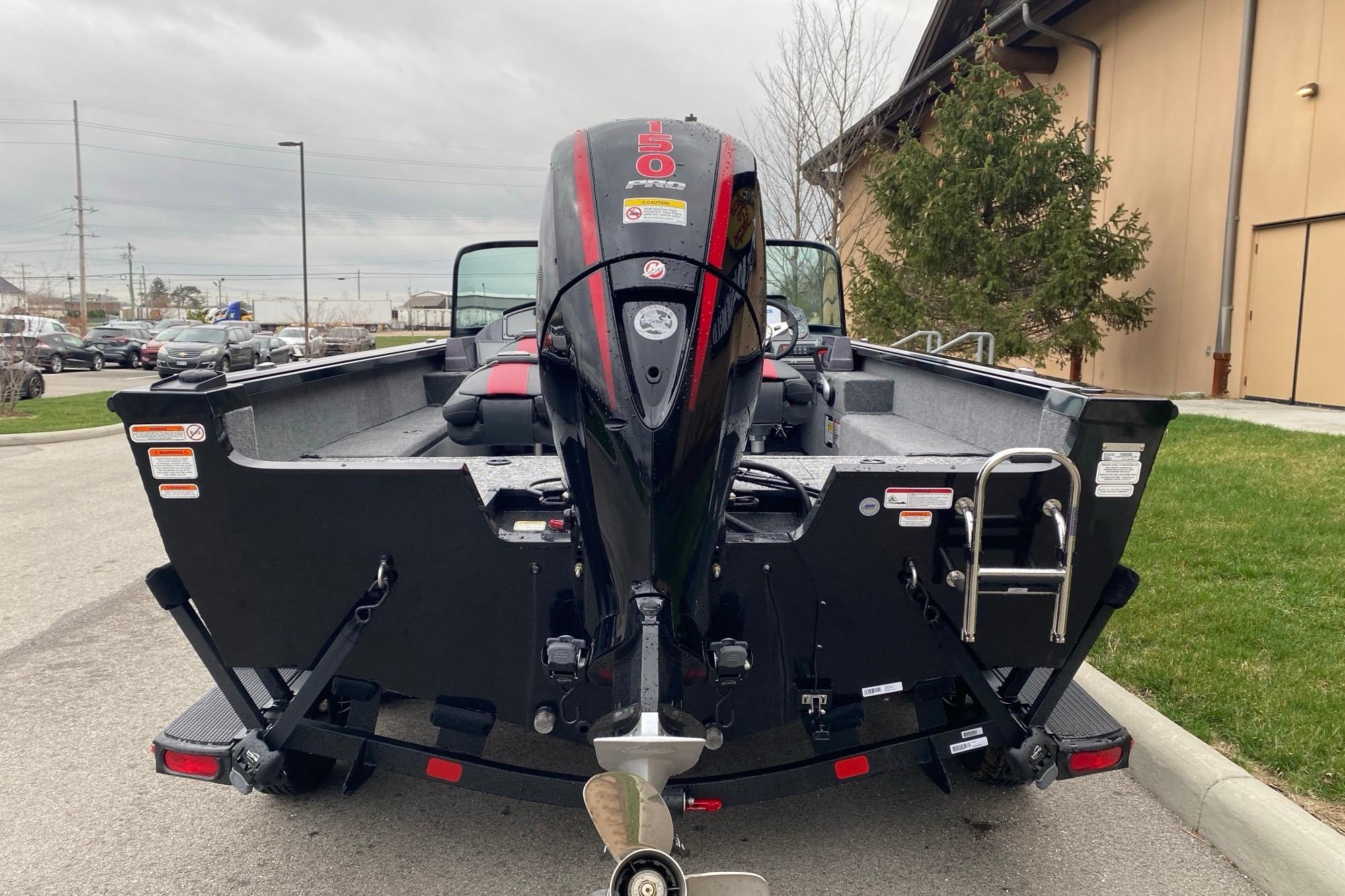 2026 Ranger VS1882SC Angler boat with powerful outboard motor, parked outdoors.