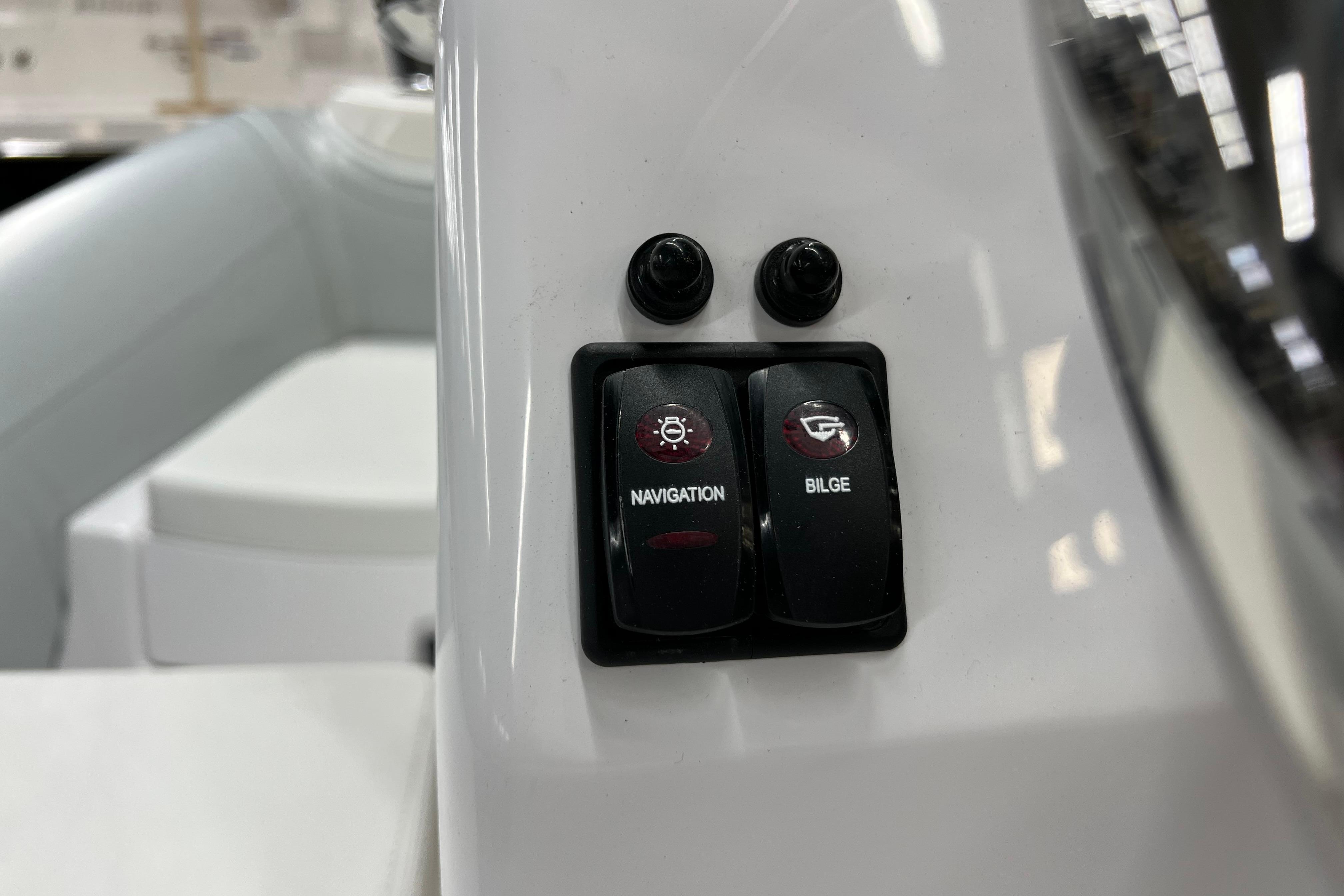 Close-up of 2023 AB Inflatables Mares 11 VSX navigation and bilge switches.