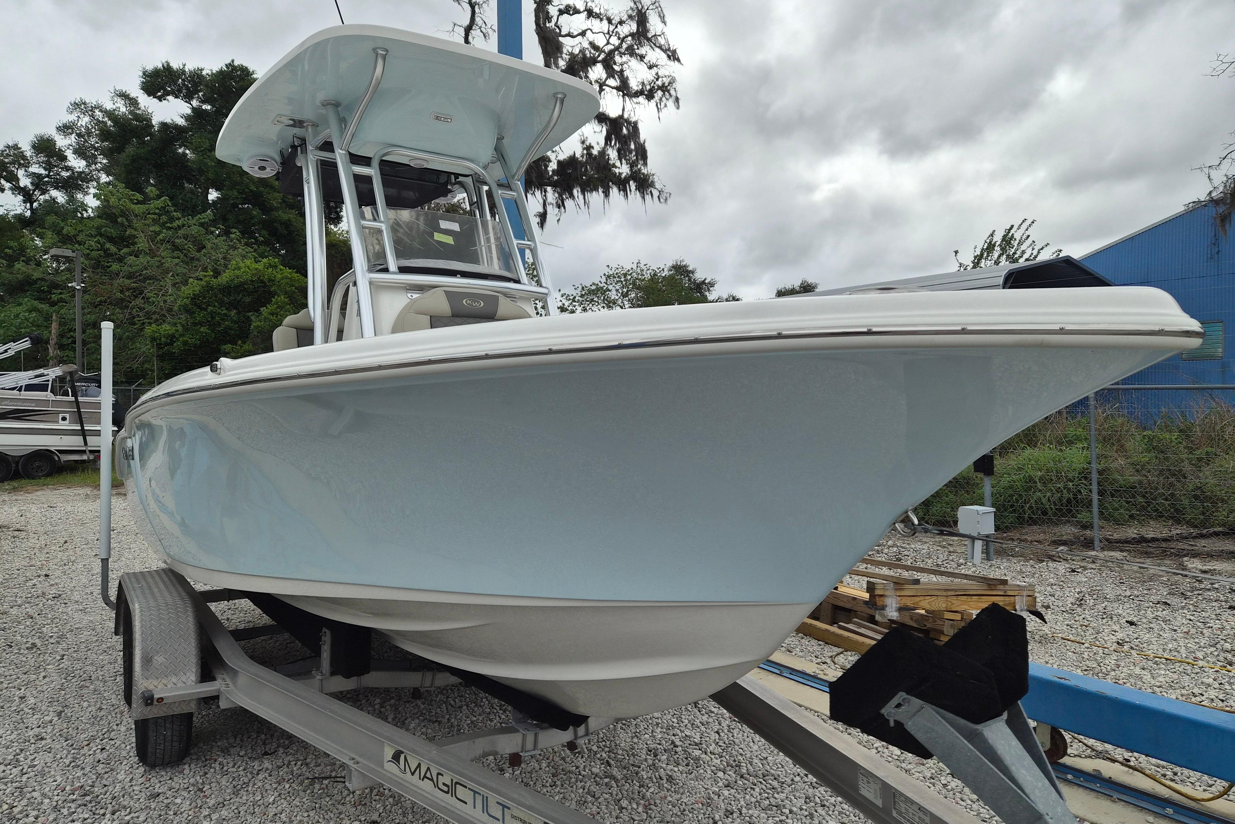2026 Key West 219 FS boat on trailer, parked outdoors on gravel.