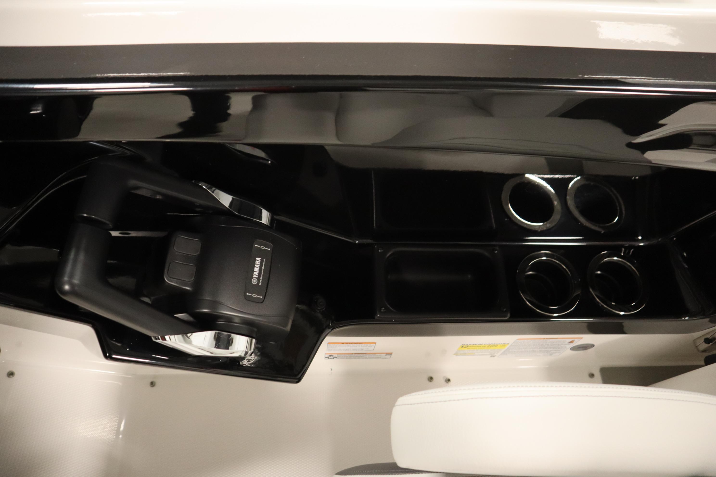 2026 Yamaha Boats AR250 dashboard with steering wheel and cup holders.