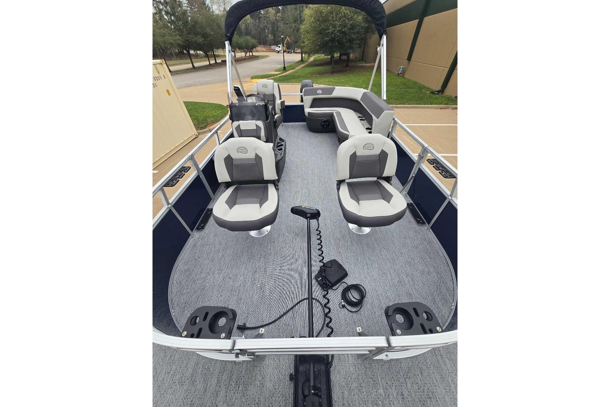 2026 Sun Tracker Bass Buggy 16 XL Select pontoon boat interior with seating and controls.